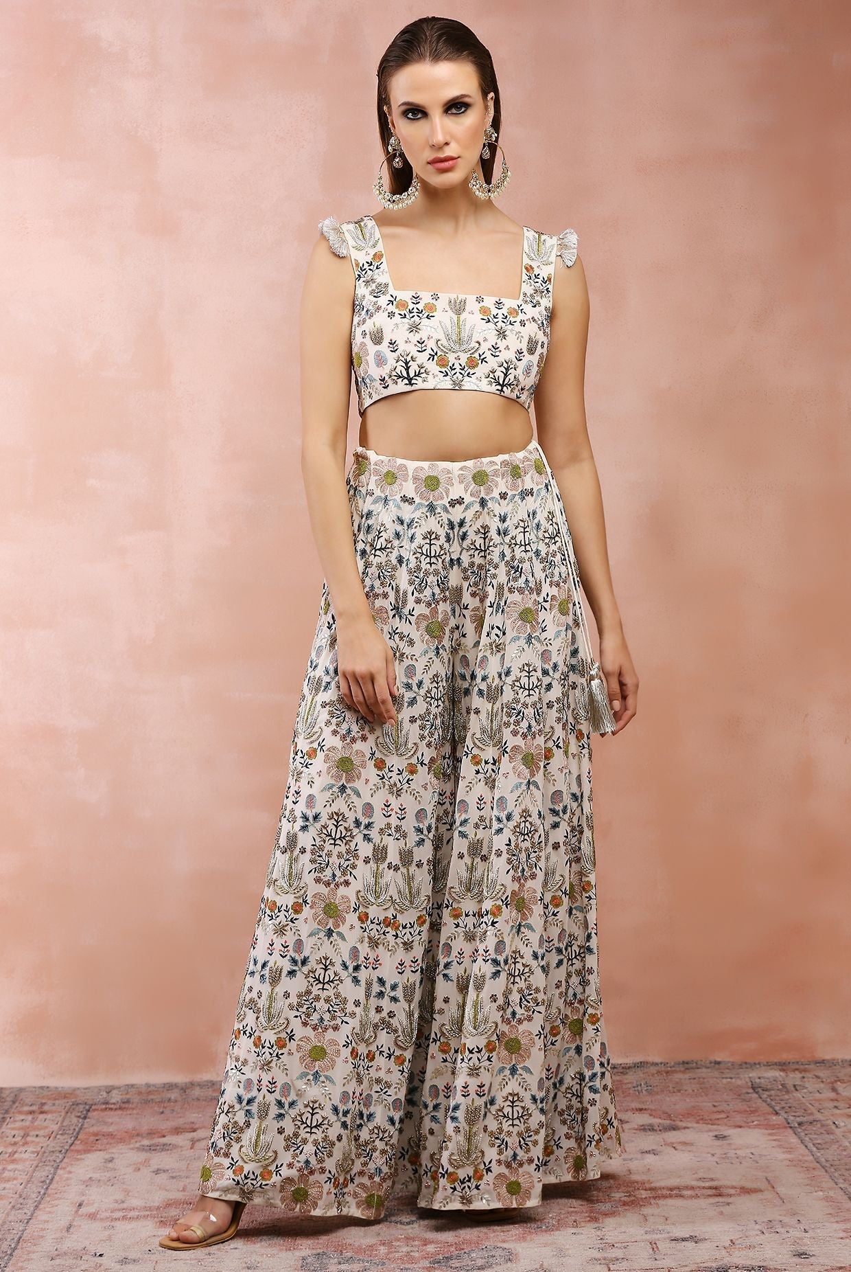Off white embroidered choli with sharara.