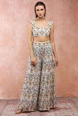 Off white embroidered choli with sharara.