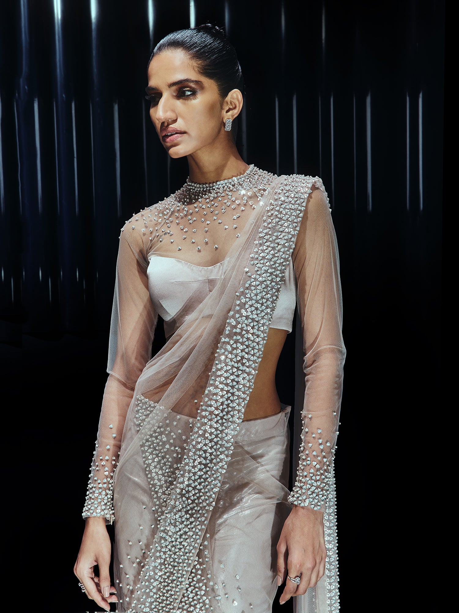 Pearl Drenched mesh saree paired with a structured sweetheart blouse