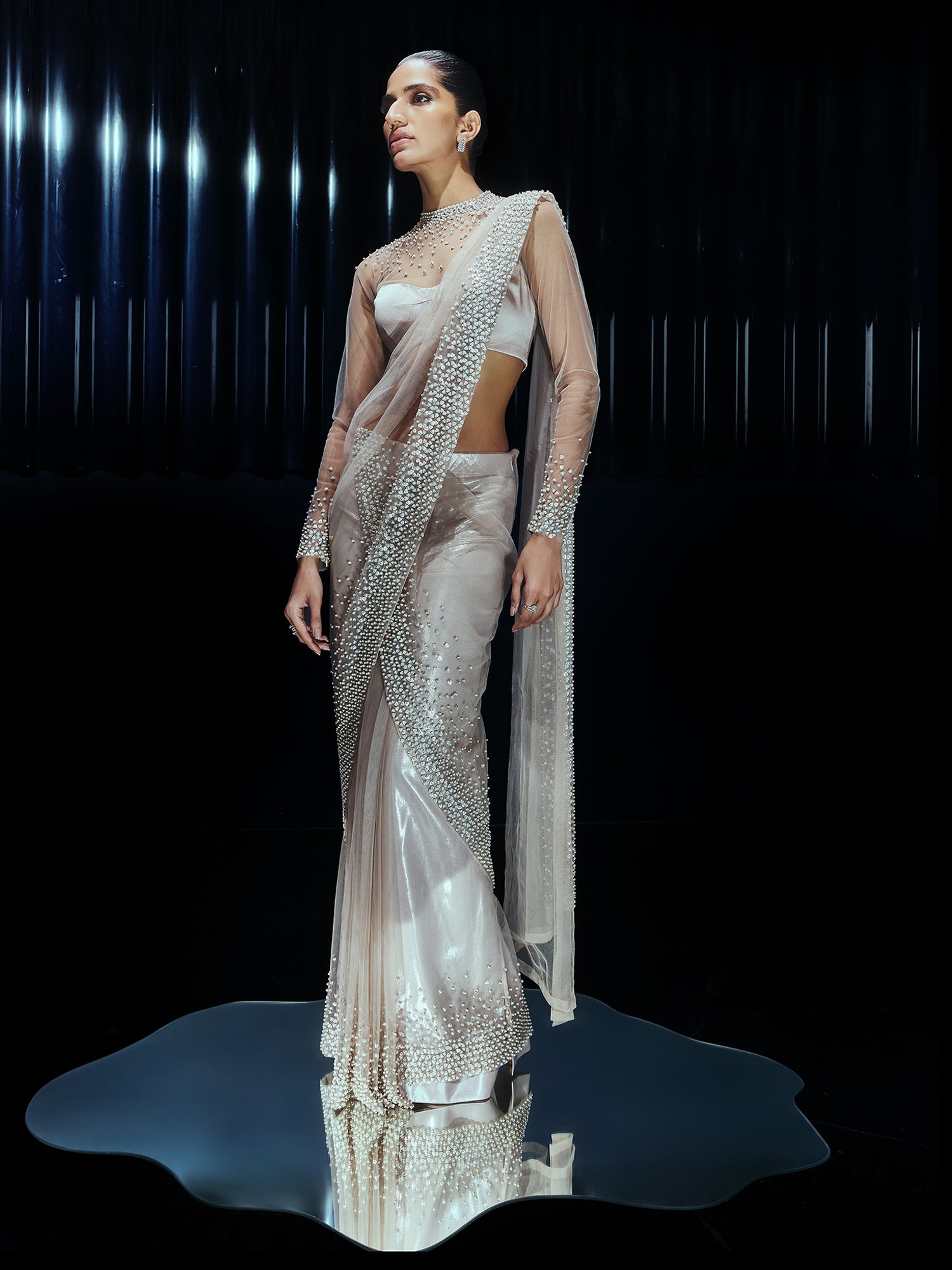 Pearl Drenched mesh saree paired with a structured sweetheart blouse