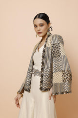IVORY JUMPSUIT WITH BELT AND CAPE JACKET
