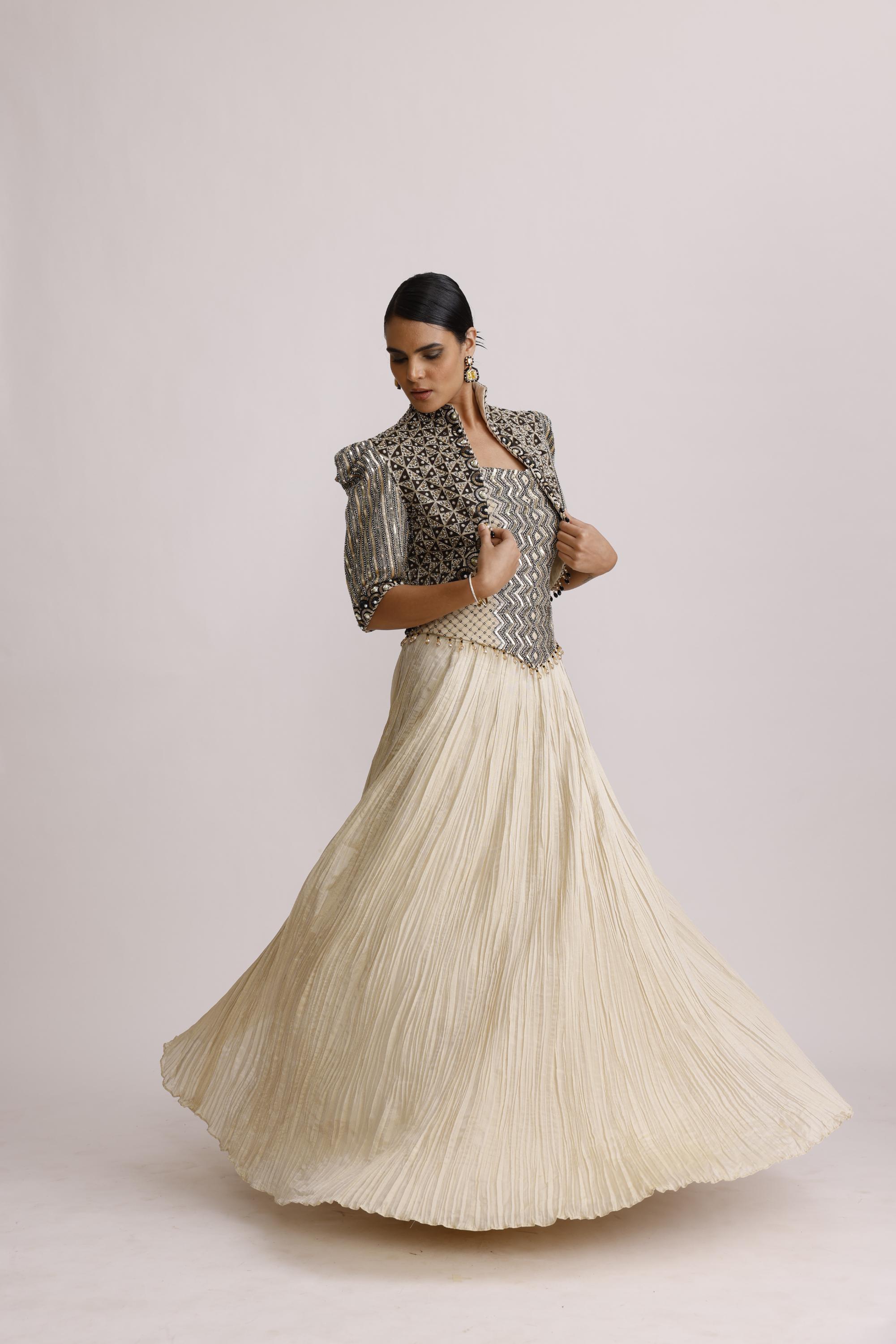 IVORY CORSET TOP WITH CRUSH SKIRT AND PAIRED WITH AJRAKH JACKET