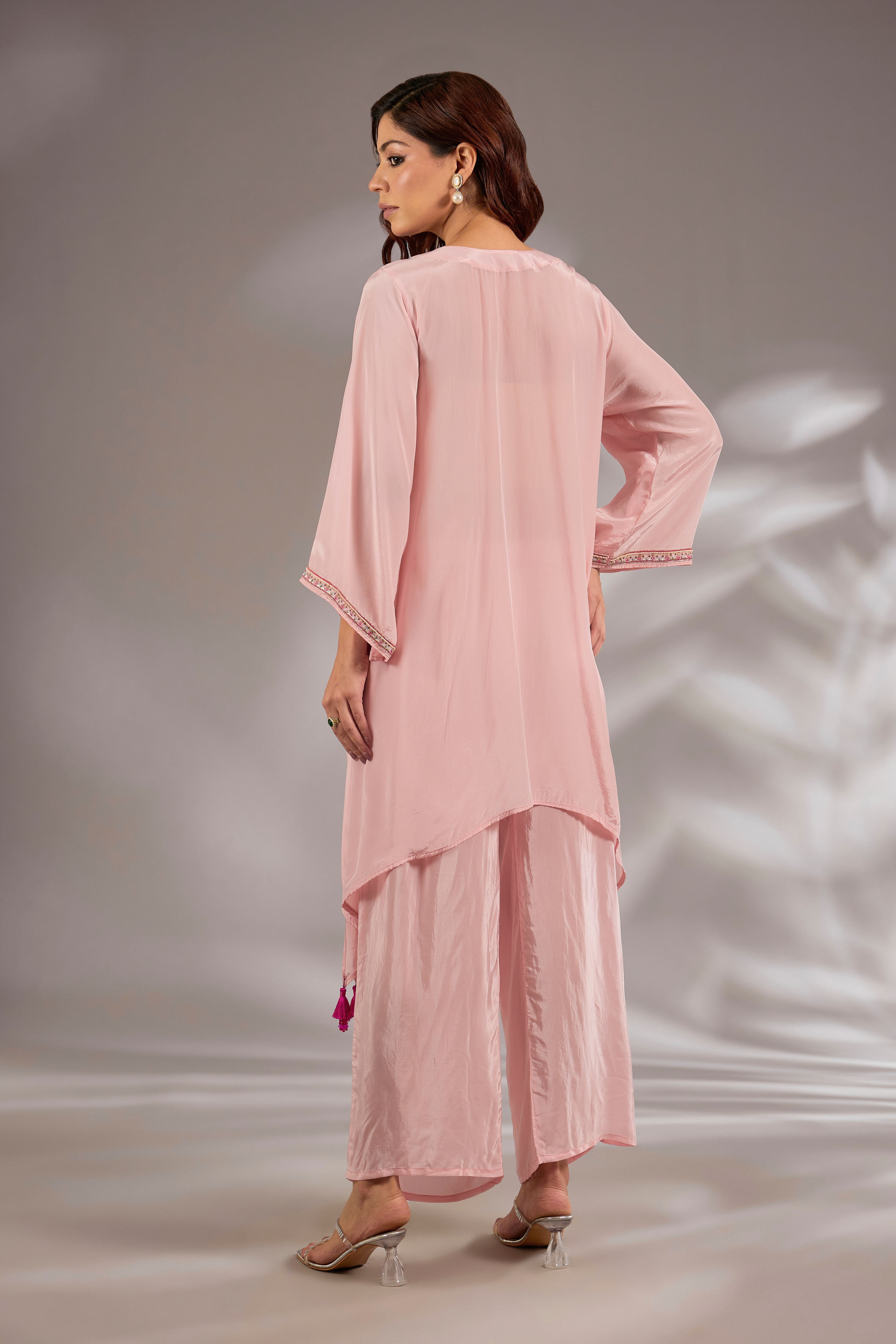 Kurta in crepe base with thread, cutdana and mirror embroidery.