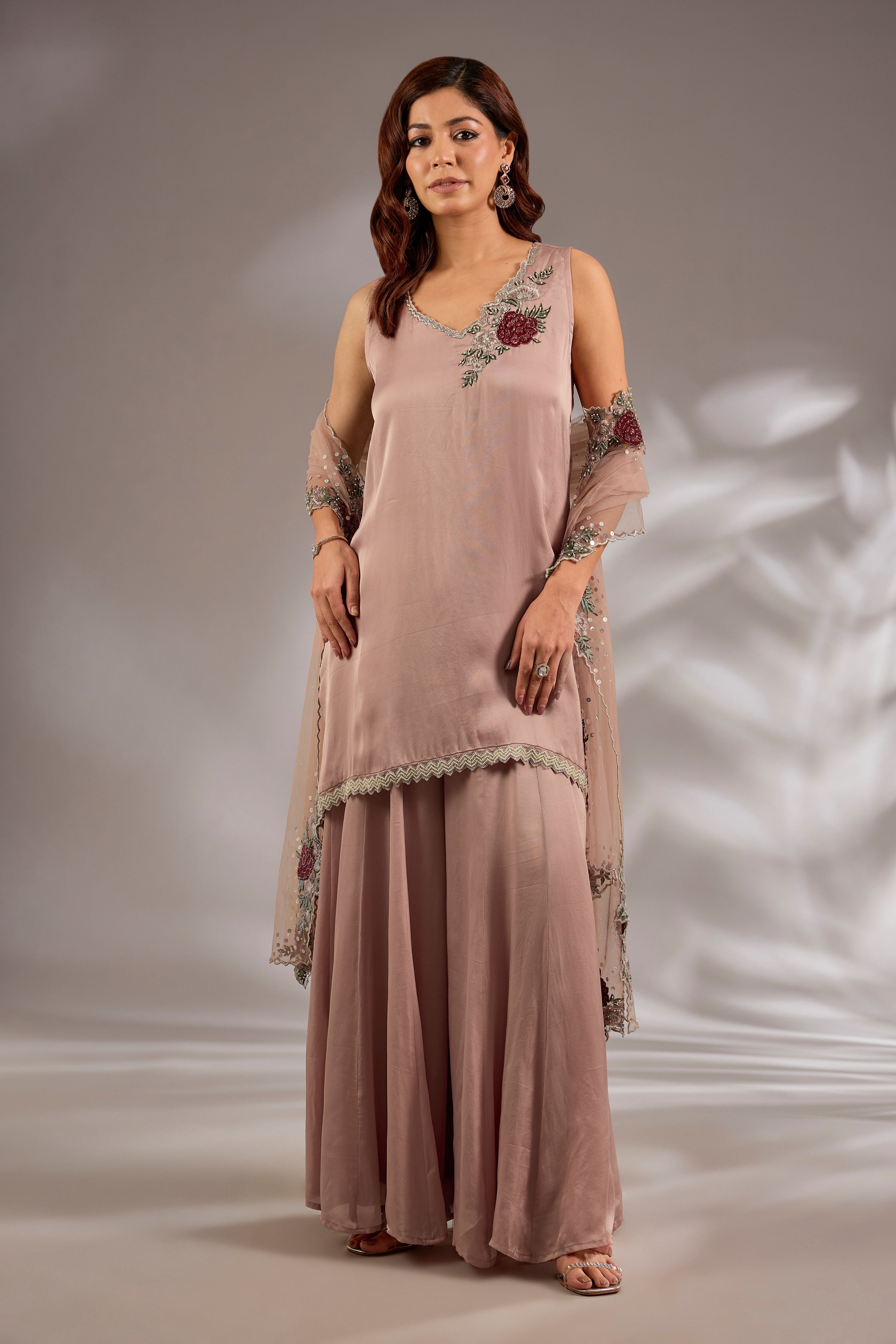 Sharara set in satin organza base with a kurta and dupatta hand and machine embroidered