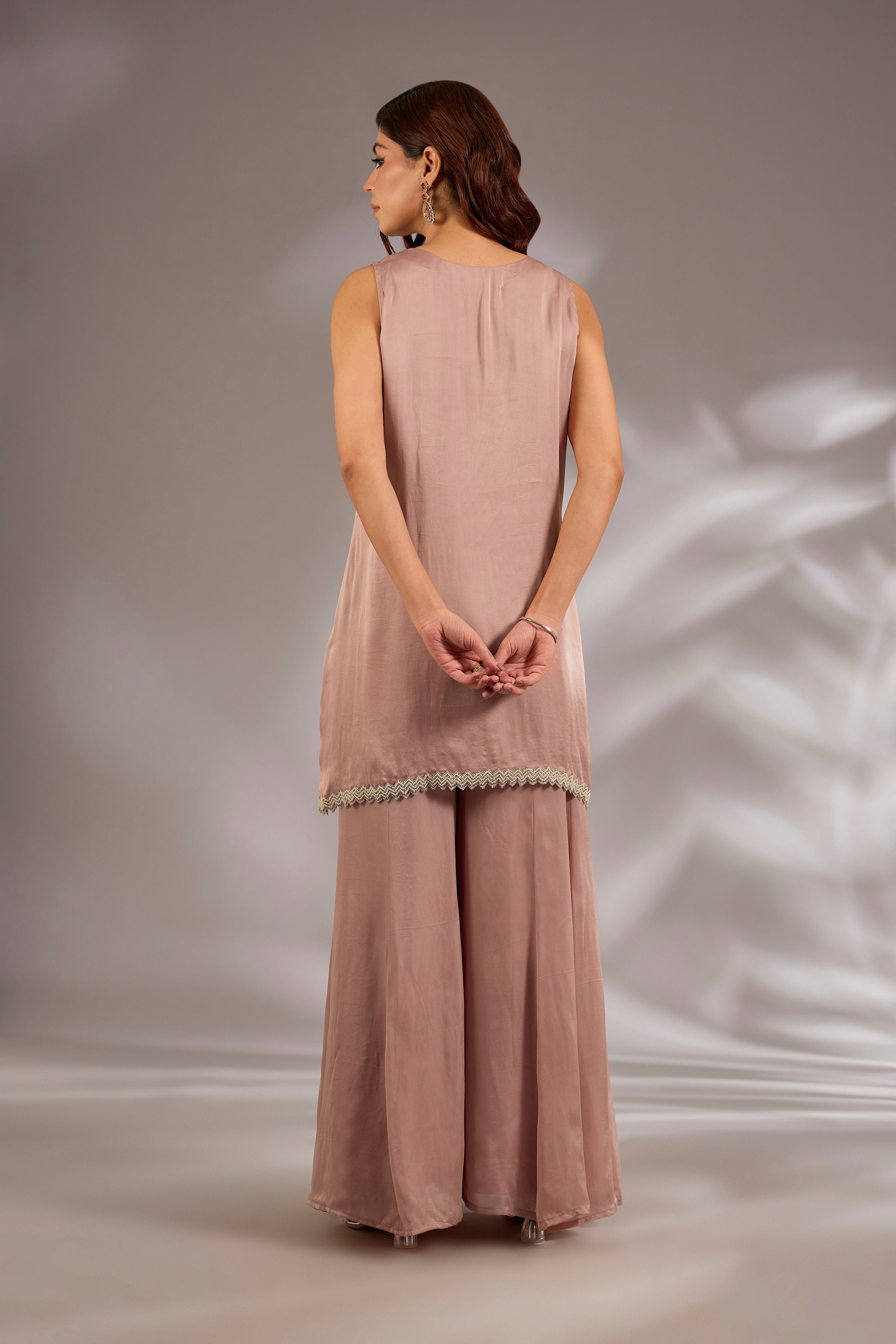 Sharara set in satin organza base with a kurta and dupatta hand and machine embroidered