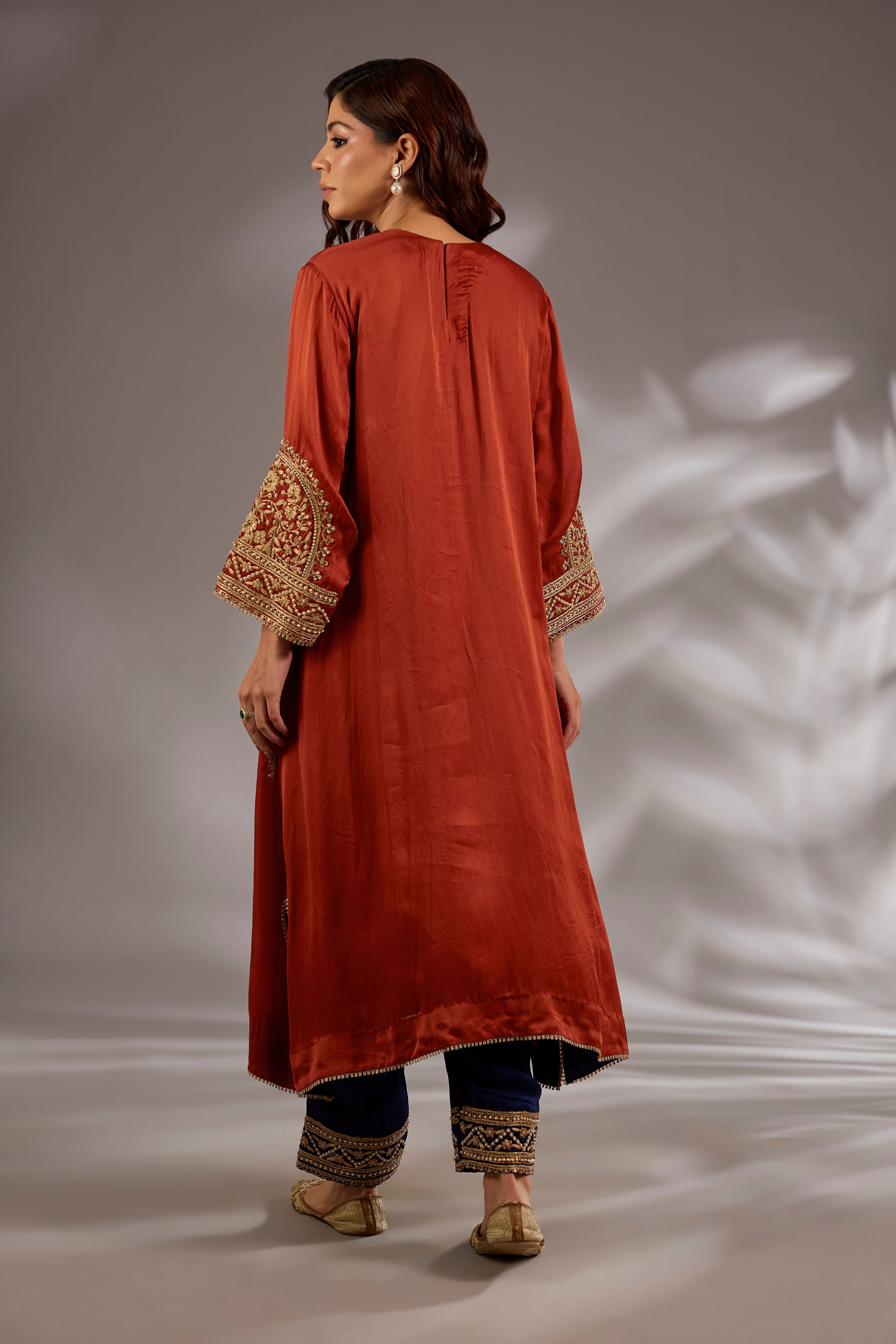 A-line kurta in satin organza base with dori hand embroidery.