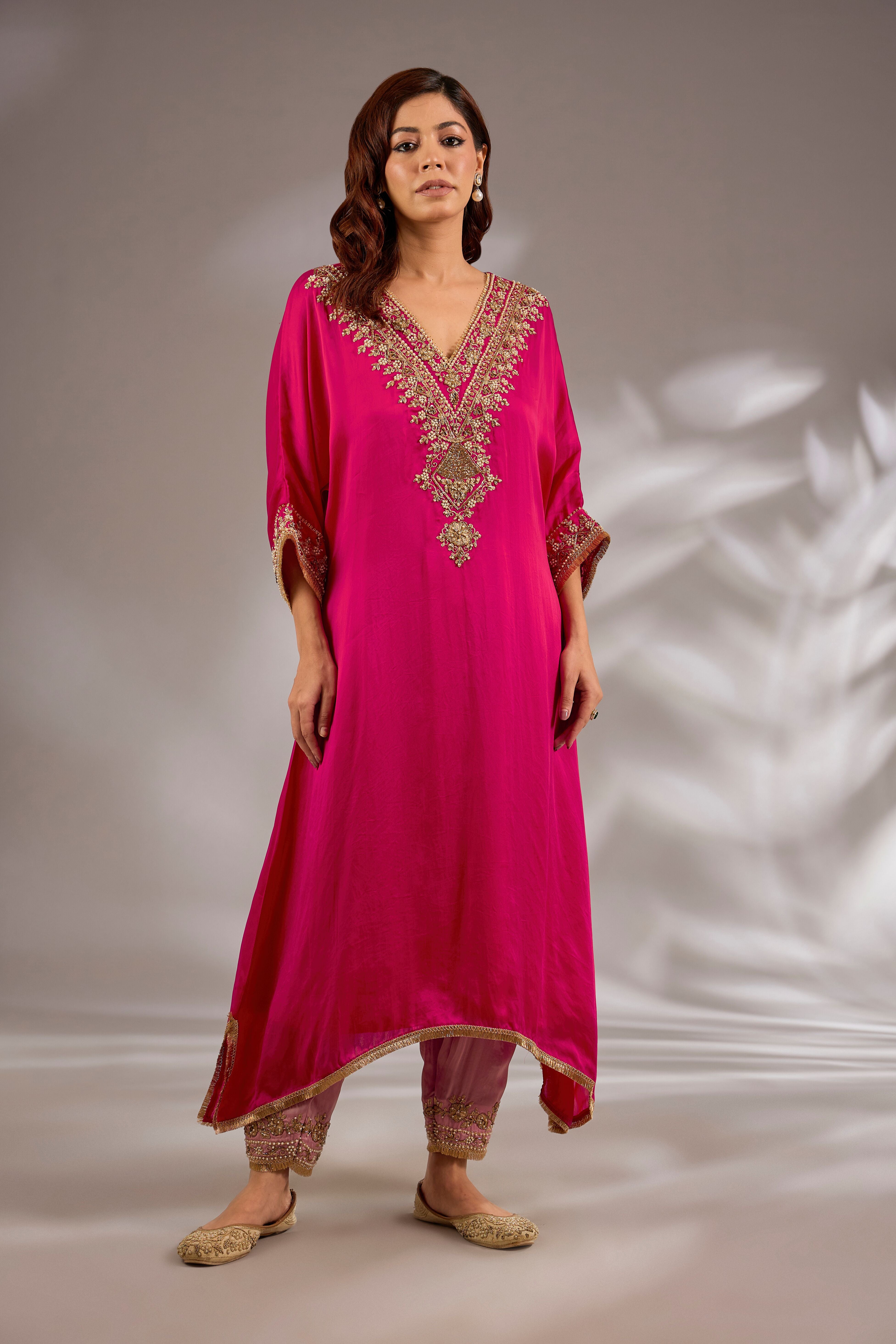A-line kurta in satin organza base with dori hand embroidery.