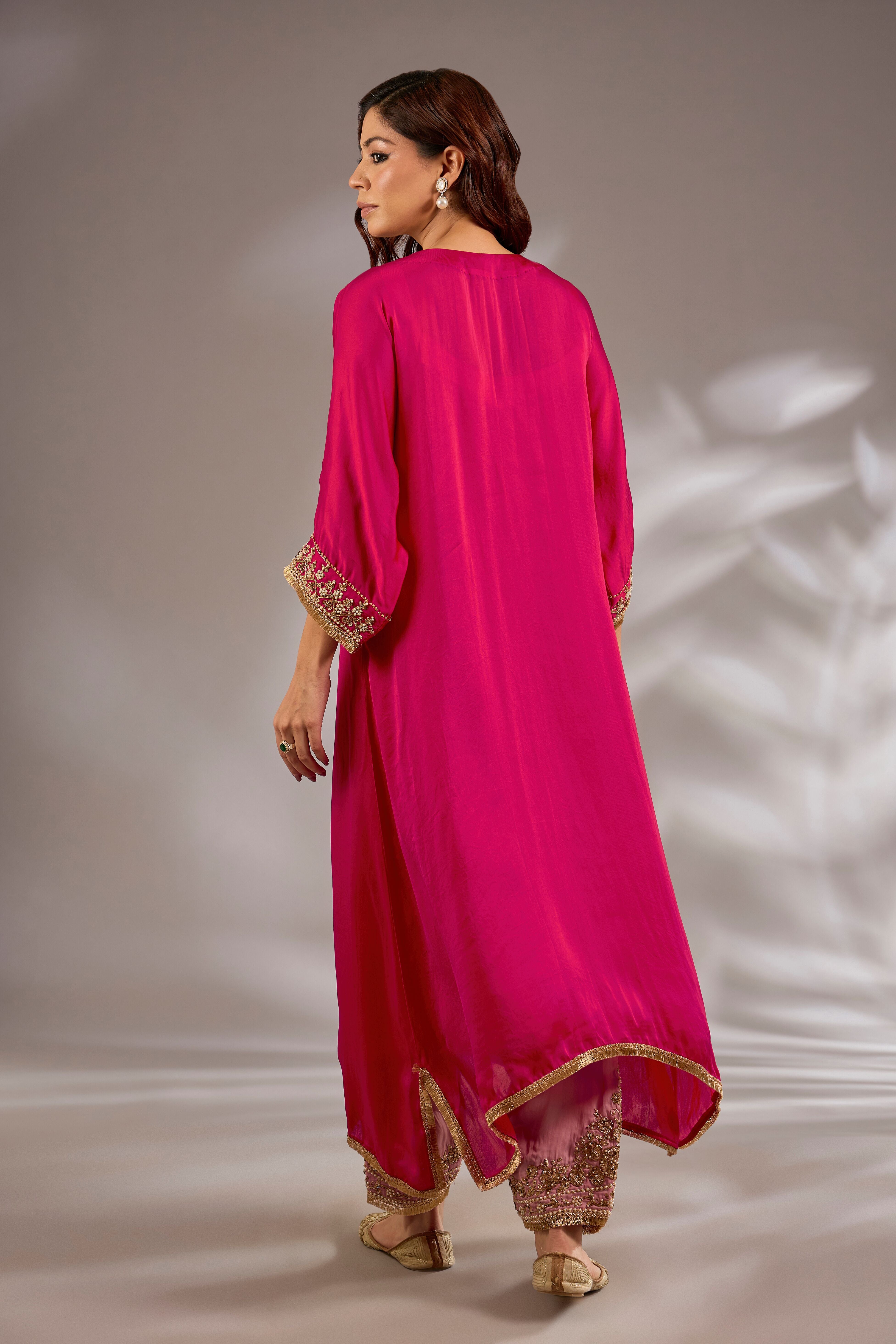 A-line kurta in satin organza base with dori hand embroidery.