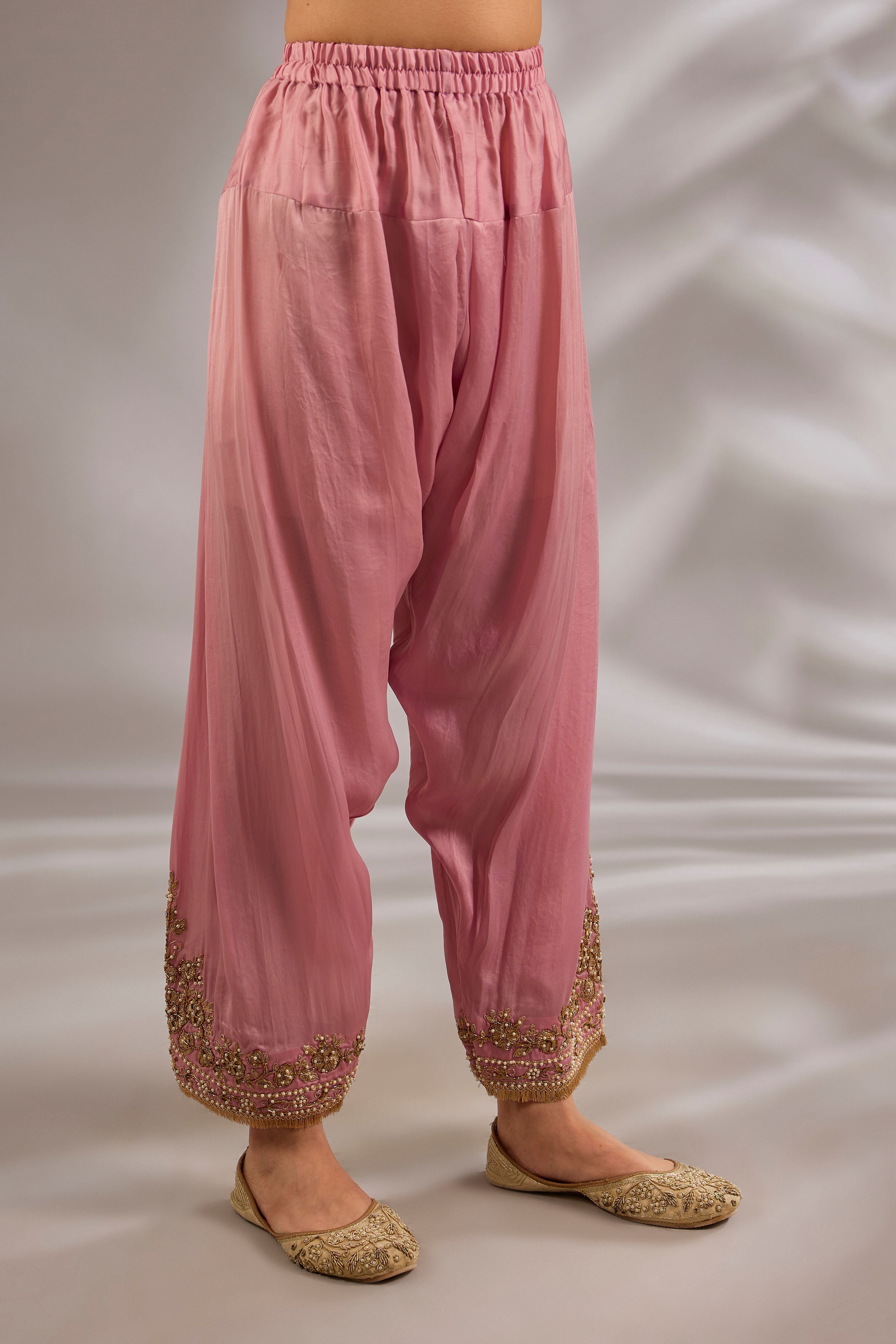 A-line kurta in satin organza base with dori hand embroidery.