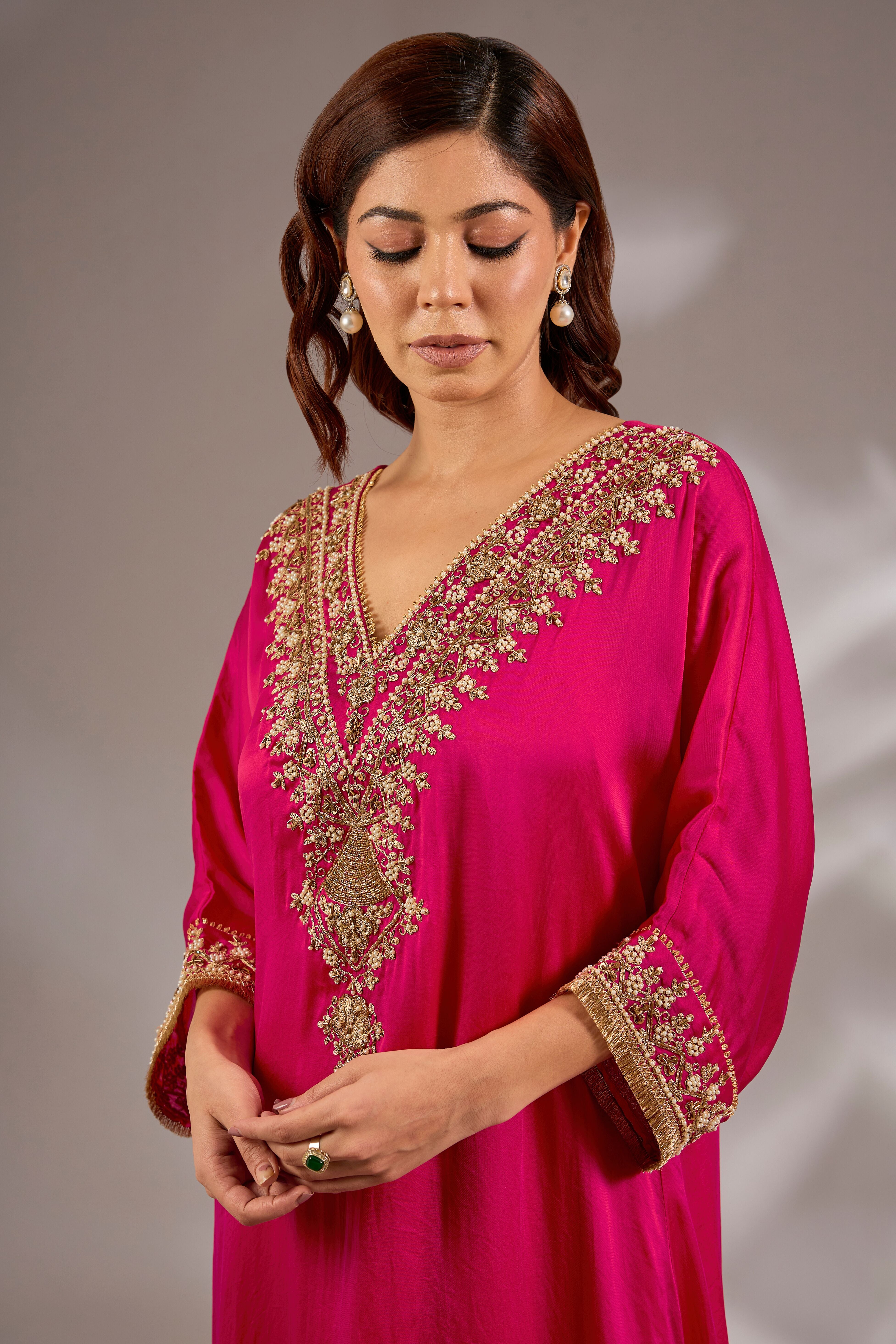 A-line kurta in satin organza base with dori hand embroidery.
