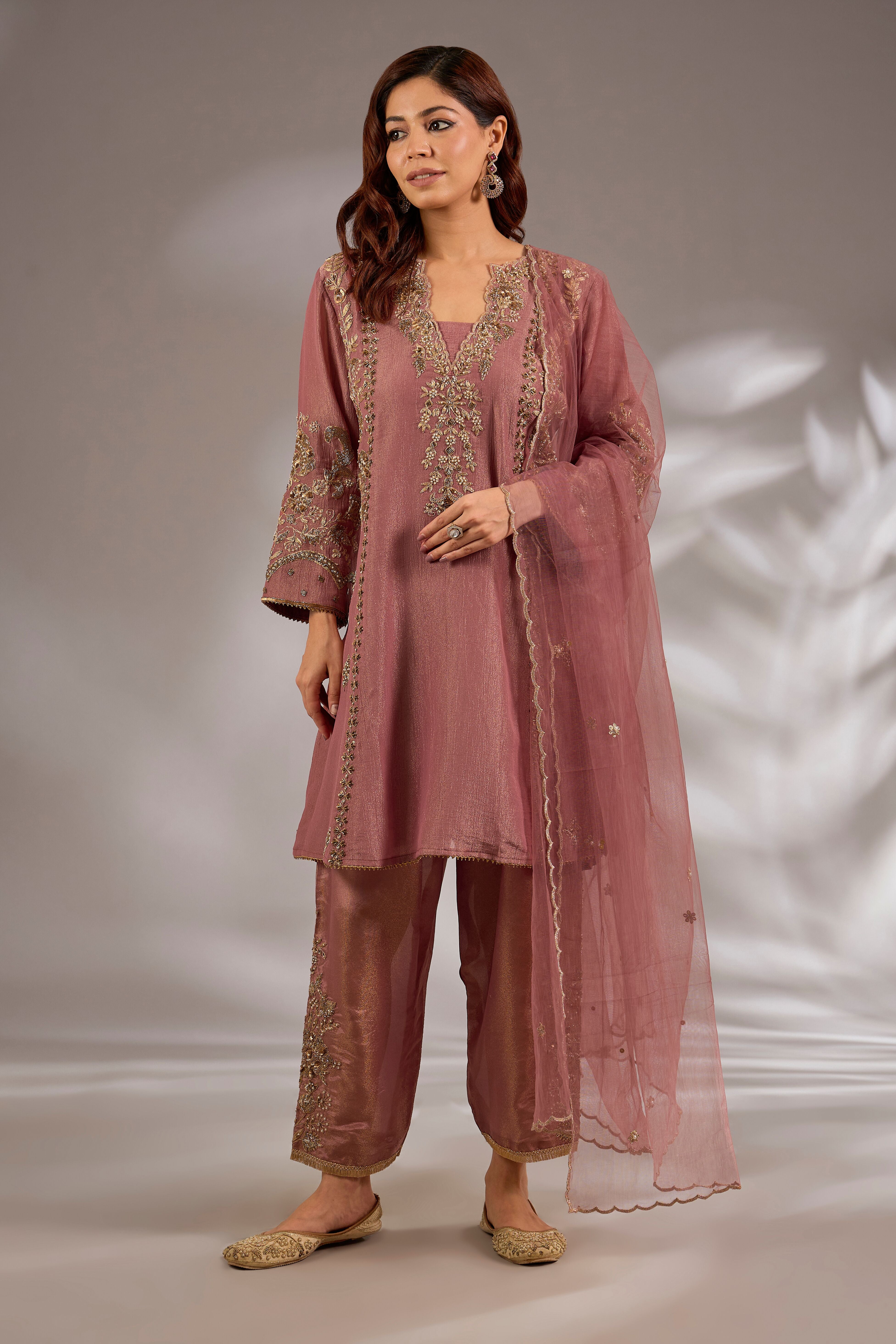 Anarkali in crush tissue base with dori hand embroidery.