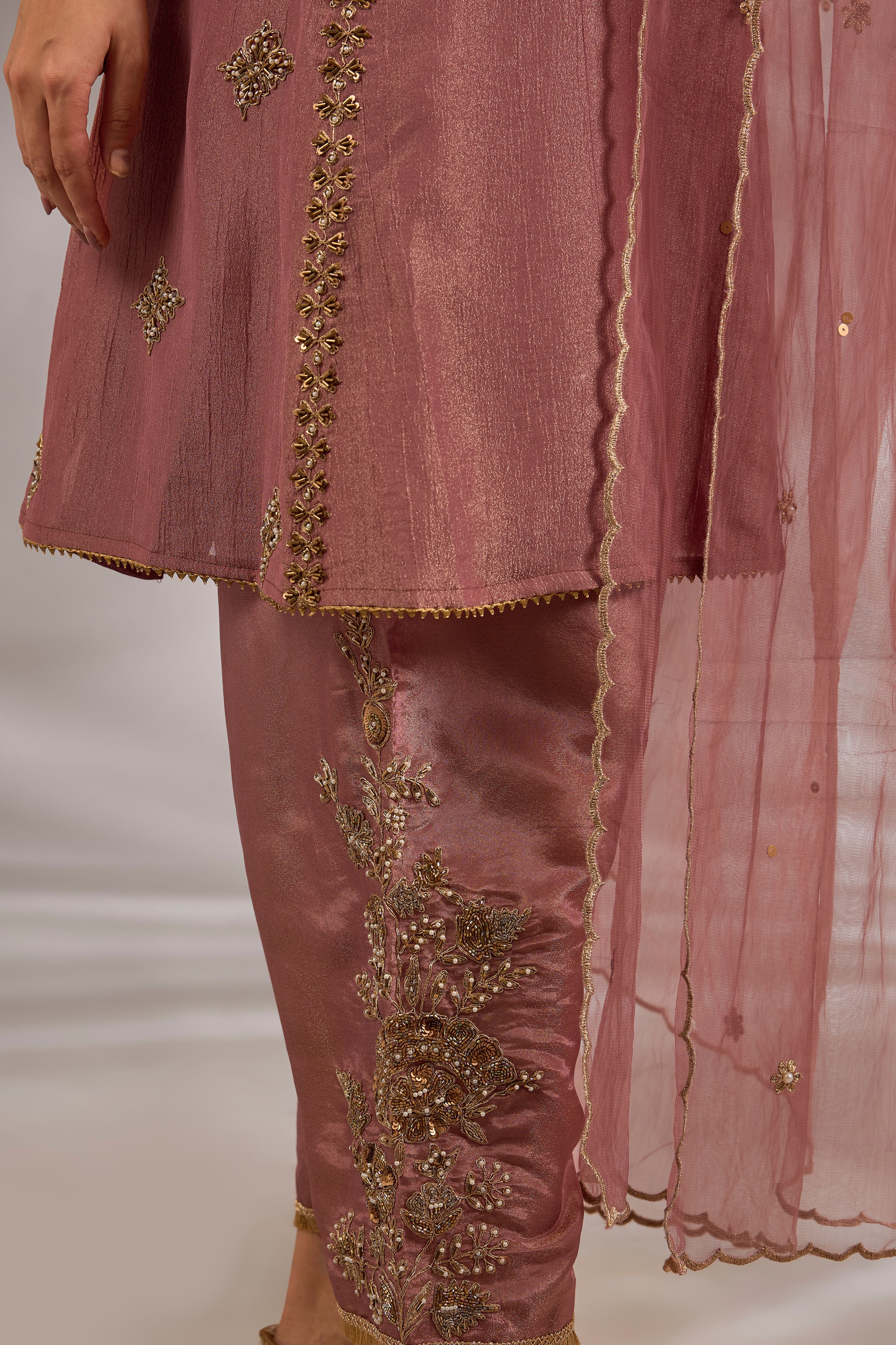 Anarkali in crush tissue base with dori hand embroidery.