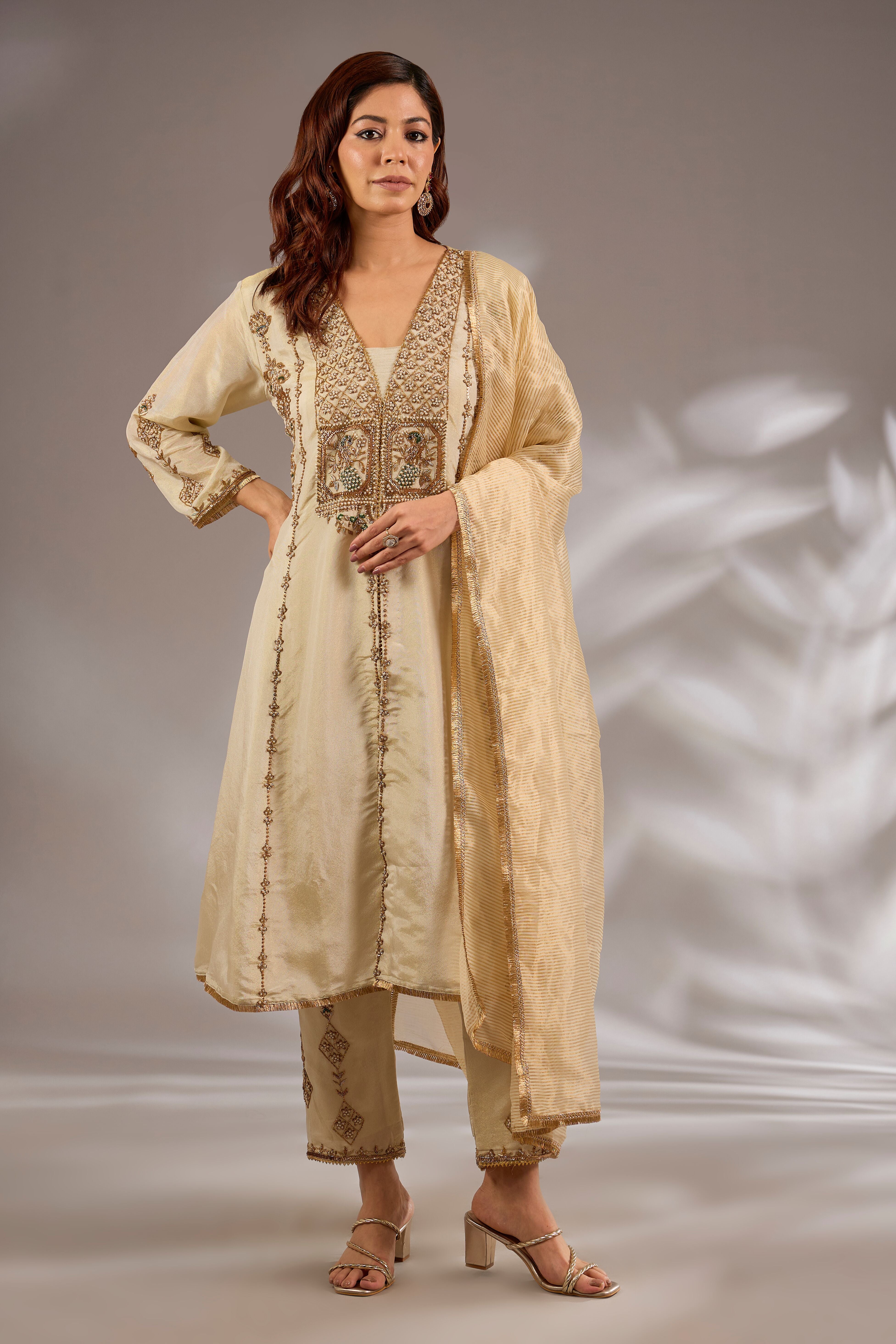Princess flared kurta in tissue base with hand embroidery.