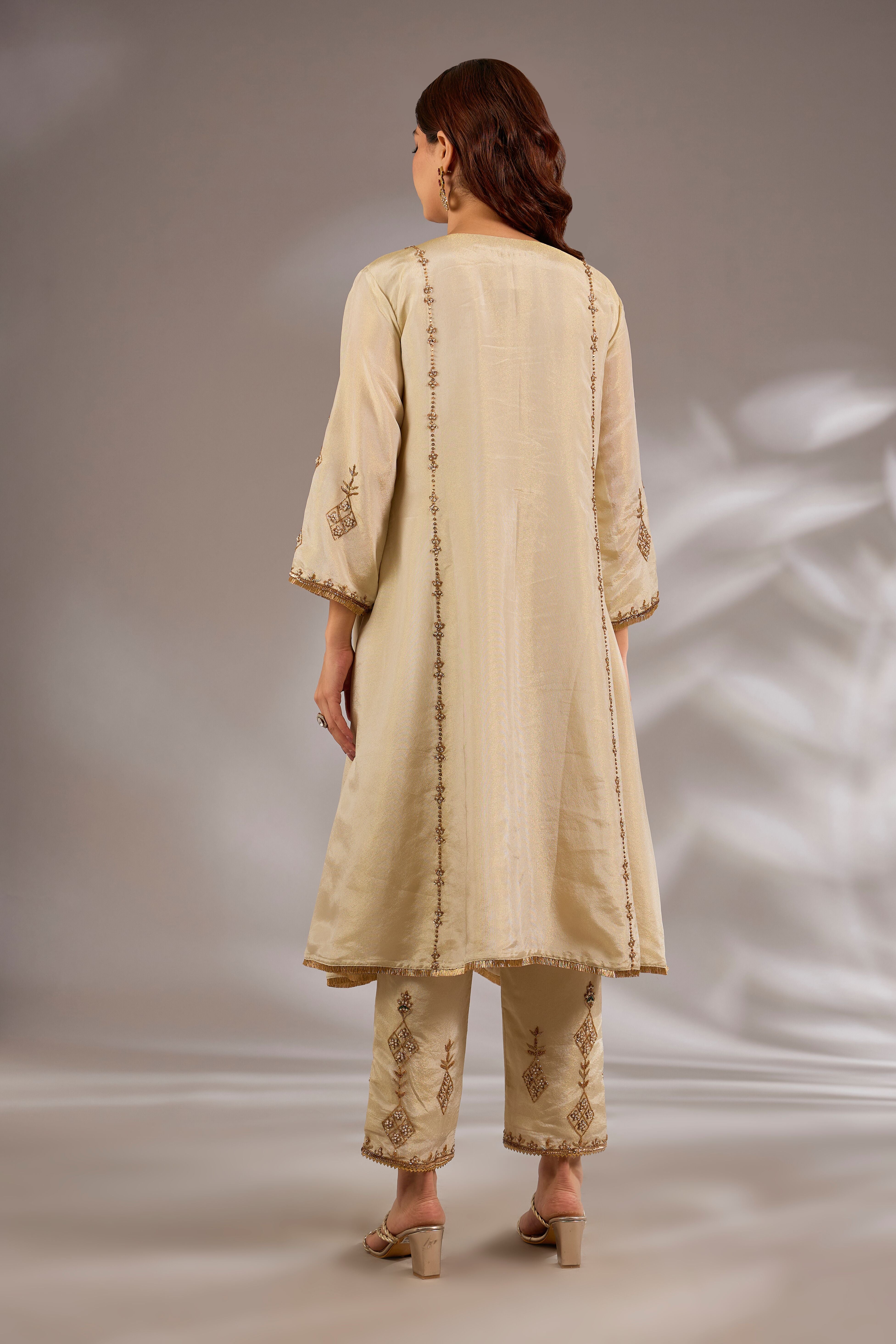 Princess flared kurta in tissue base with hand embroidery.
