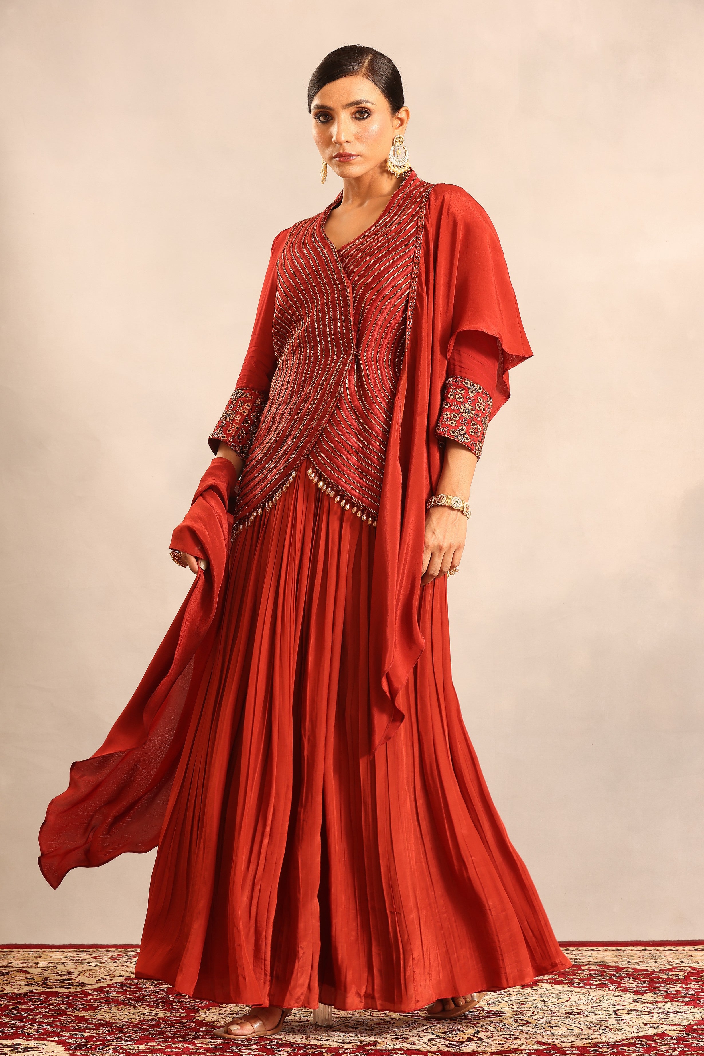 Red strip embroidered overlap jacket with pleated skirt and ruffled dupatta