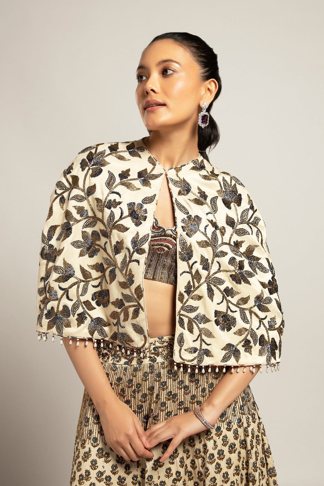 Lissome faded ivory blouse & Cape with Comely lehenga