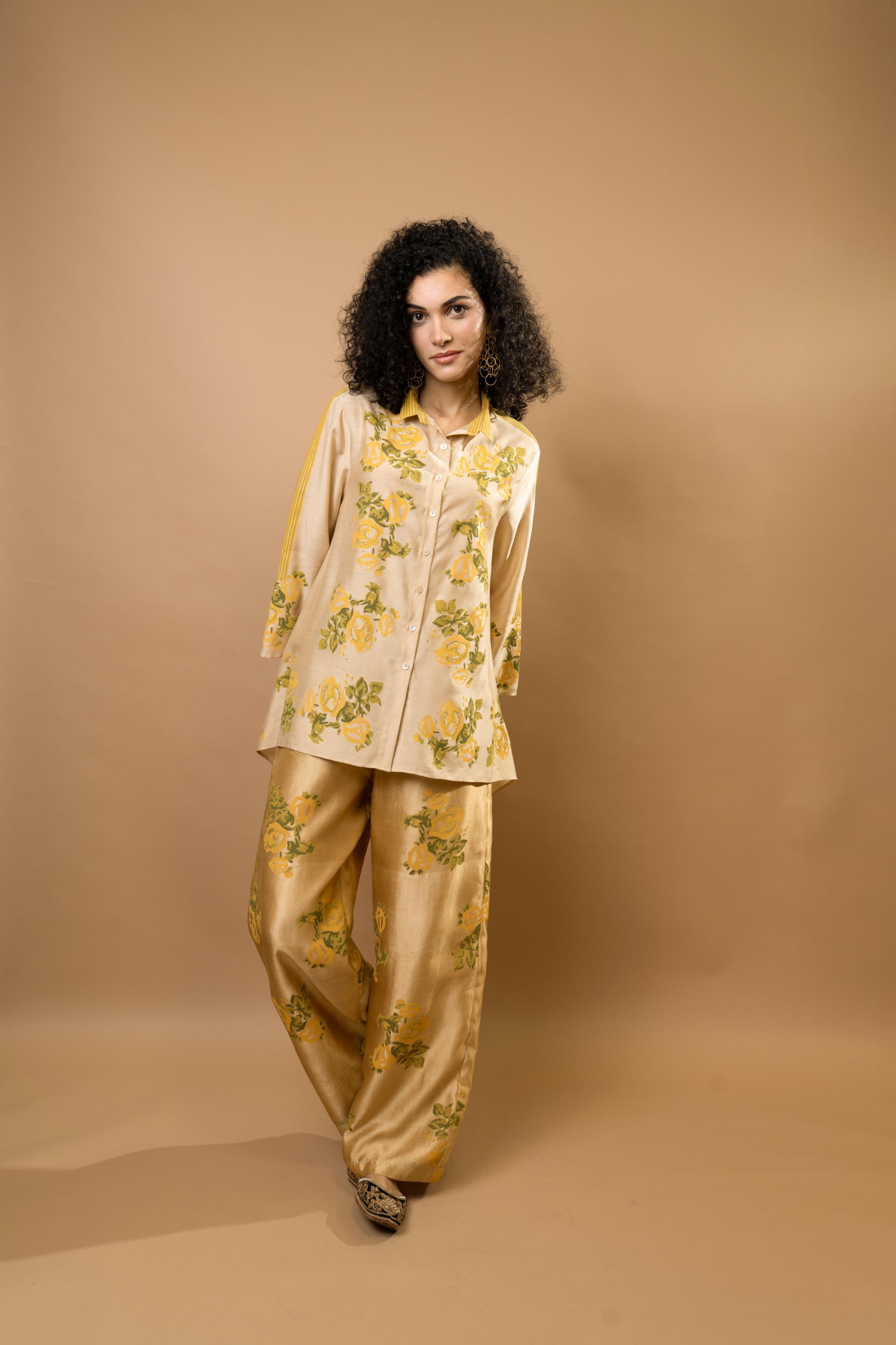 Beige rosettes block-printed asymmetrical hem shirt