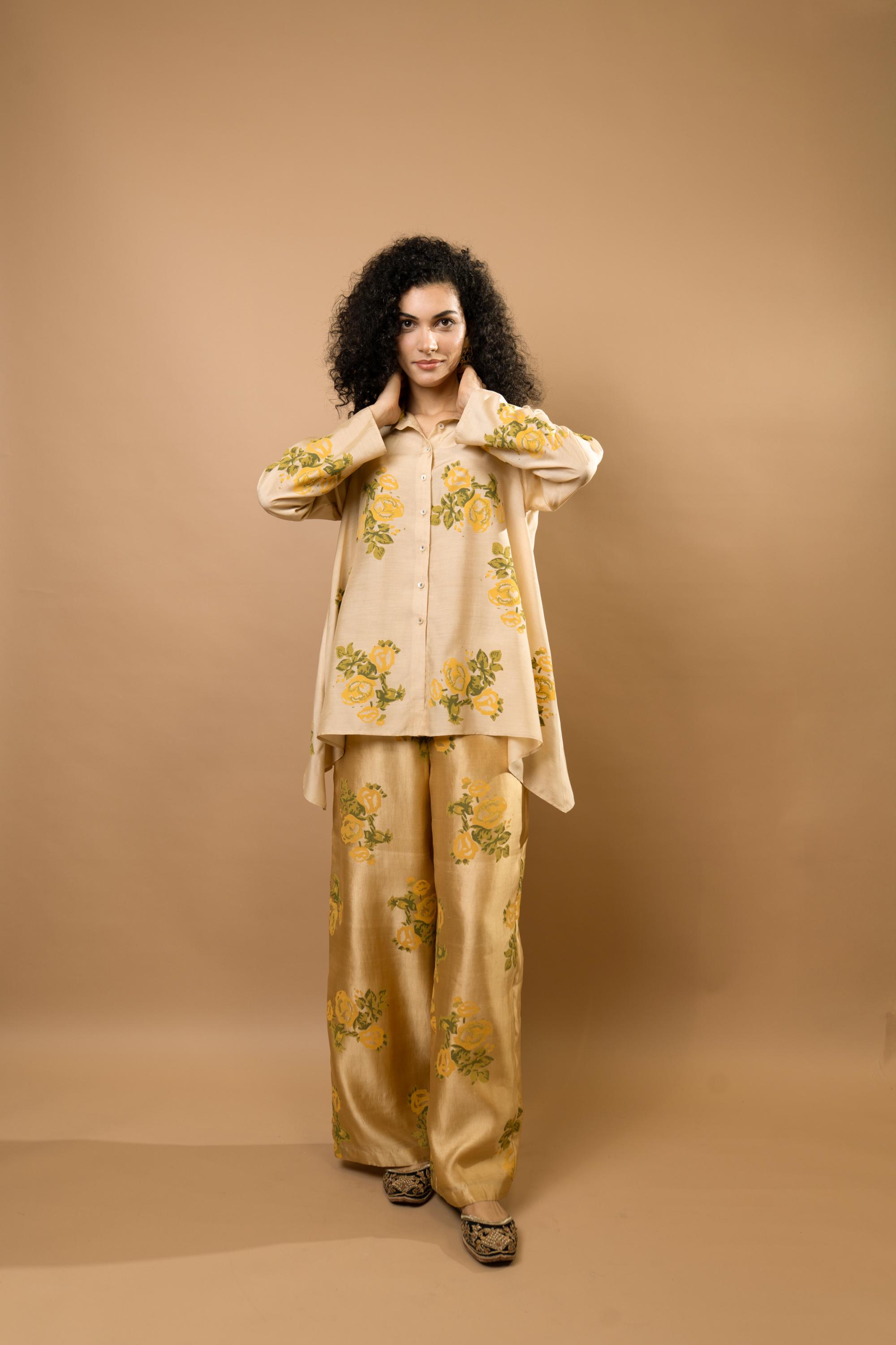 Beige rosettes block-printed asymmetrical hem shirt