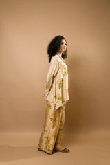 Beige rosettes block-printed asymmetrical hem shirt