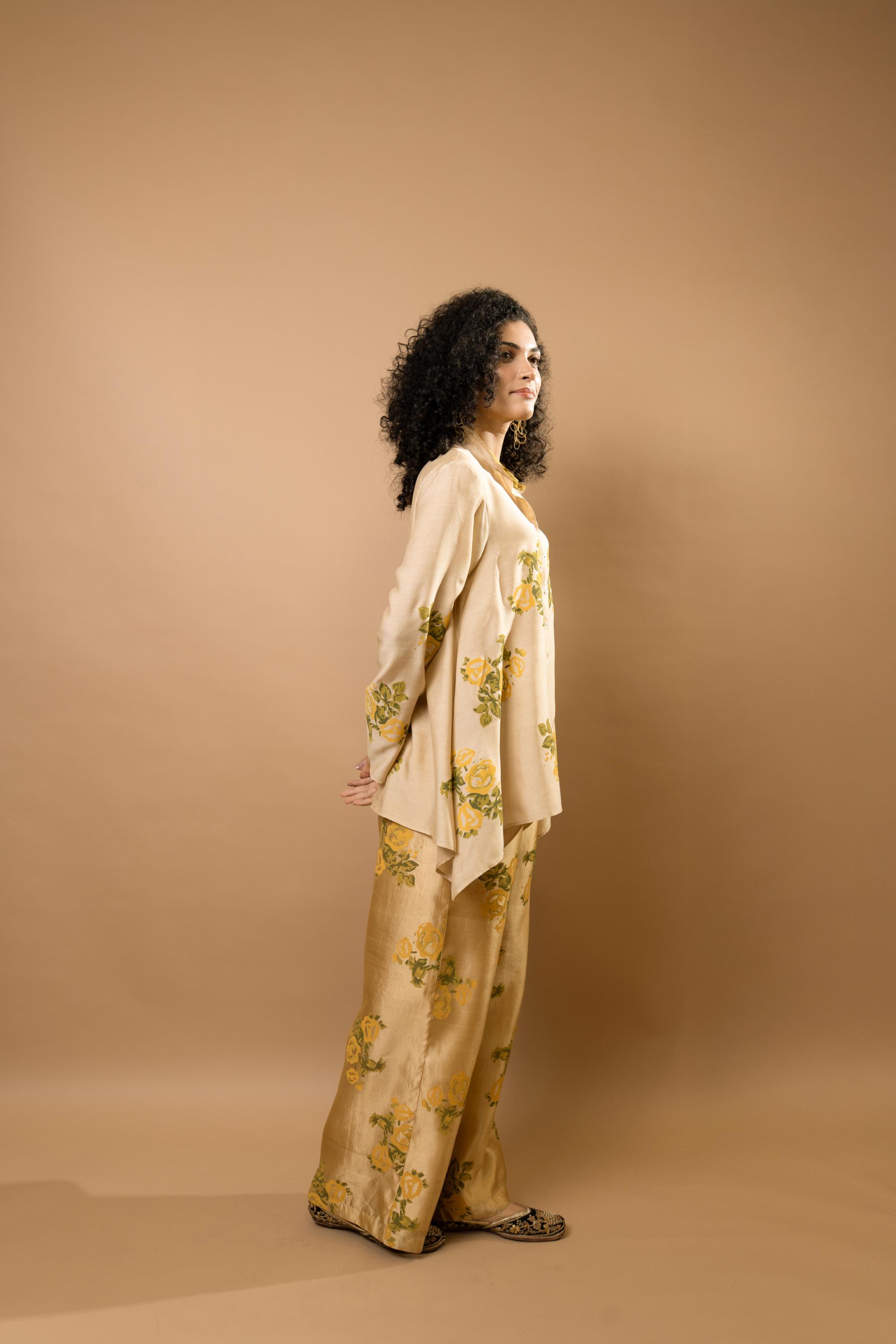 Beige rosettes block-printed asymmetrical hem shirt