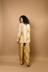 Beige rosettes block-printed asymmetrical hem shirt