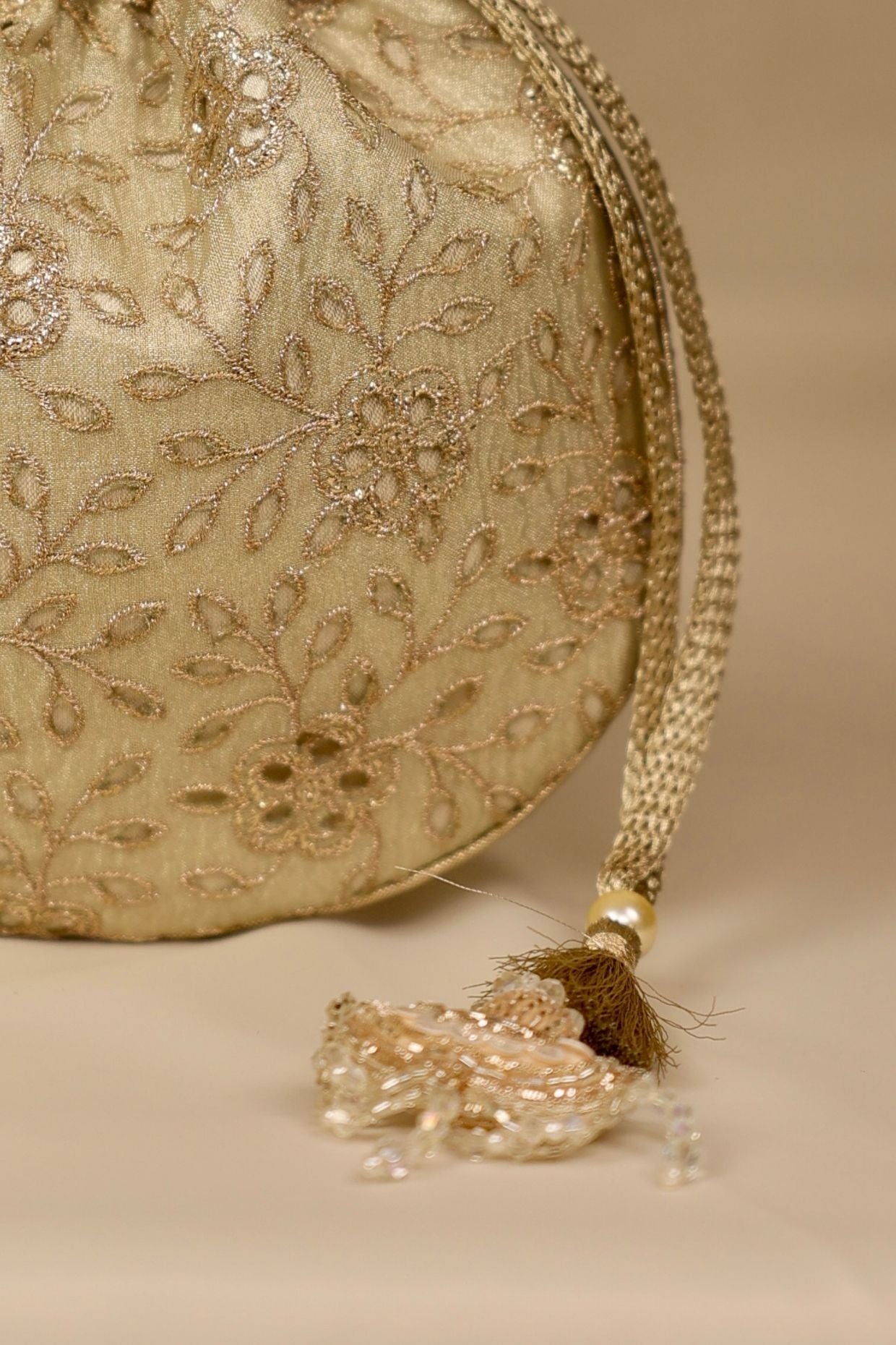 Tarang cutwork potli - Light gold
