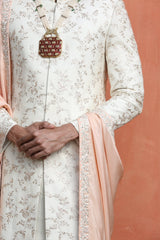 IVORY RAW SILK EMBROIDERED SHERWANI WITH MONGA TASSAR SILK KURTA AND CHURIDAR