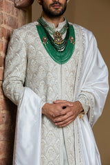 IVORY TAFETTA ACHKAN AND BELT ALL OVER EMBROIDERED WITH MONGA KURTA AND CHURIDAR