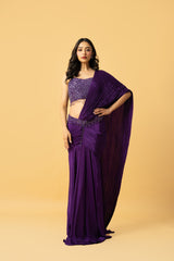 Violet crepe saree with hand embroidered sleeveless blouse