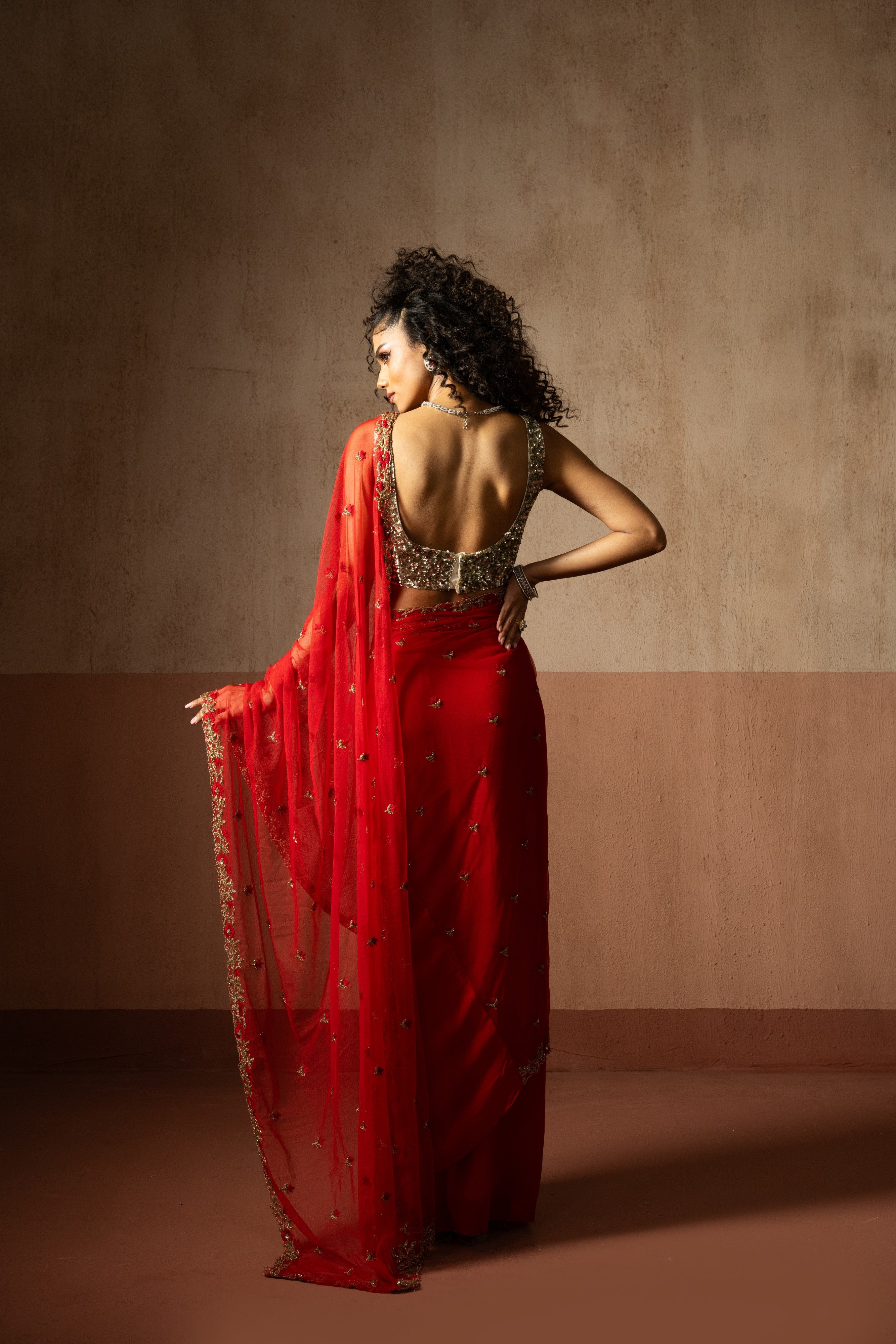 Predraped , red , hand embroidered net & georgette saree with golden blouse