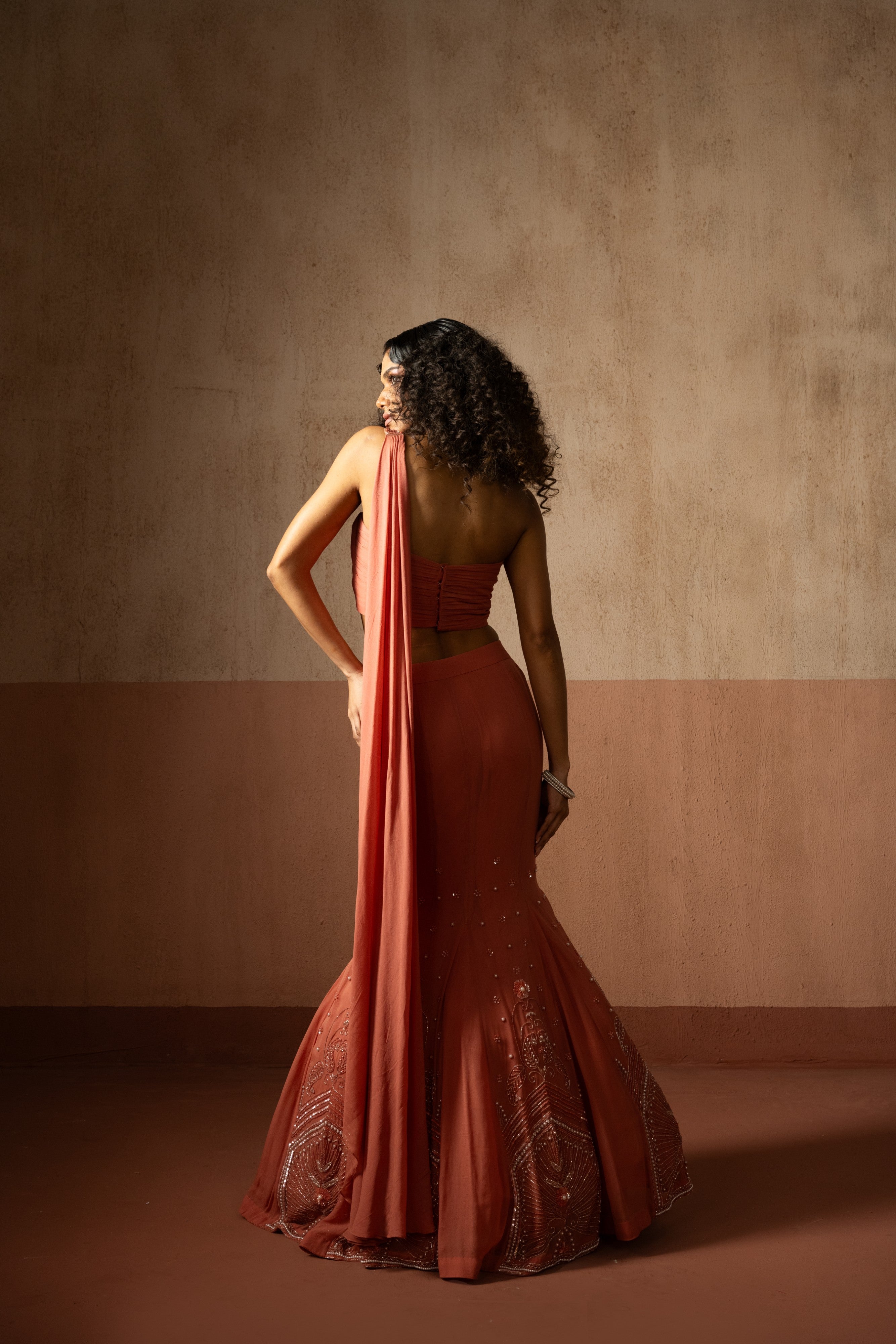 Fishtail style , peach coloured, hand embroidered georgette fishtail saree
