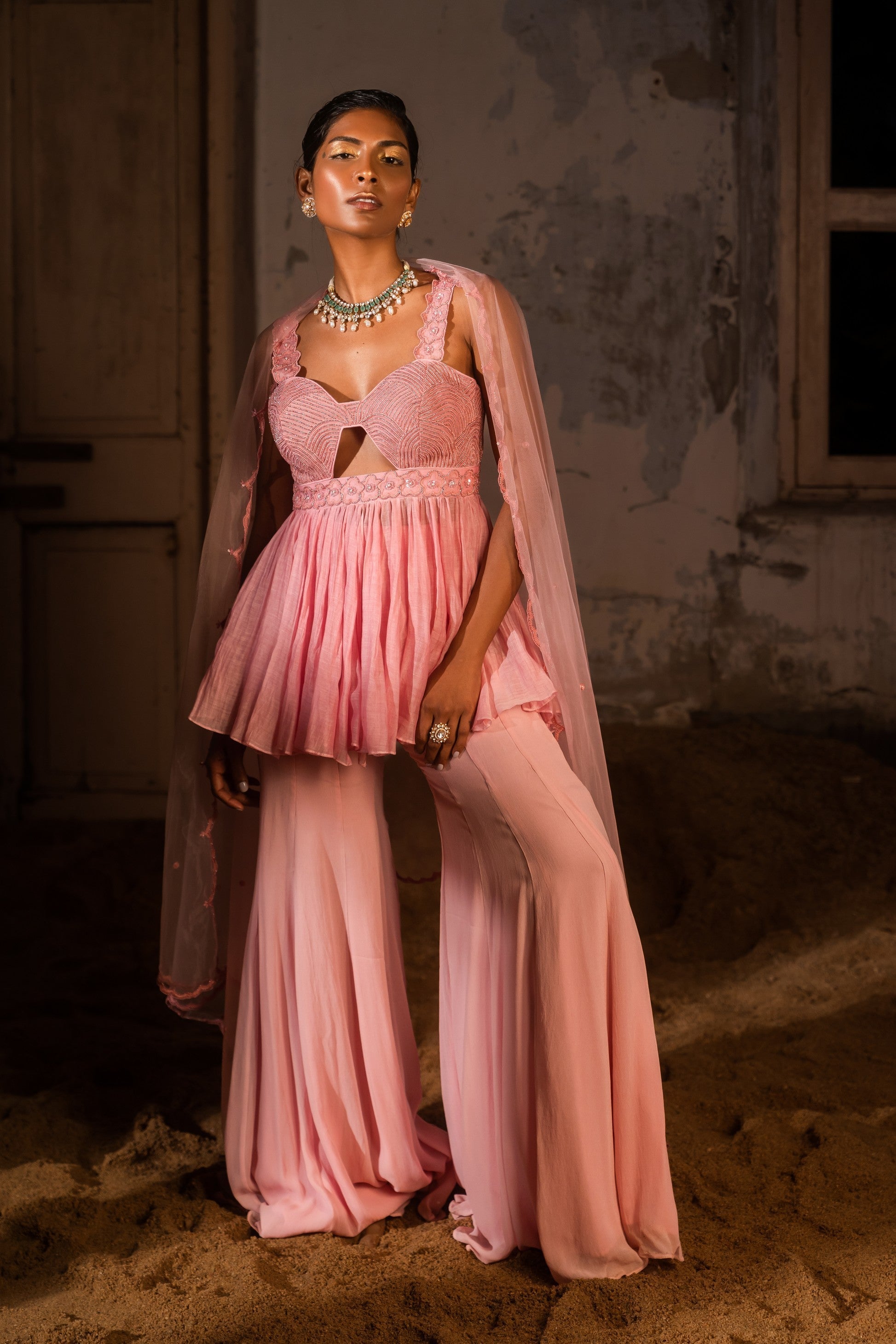 A thread work peplum set with sharara pants