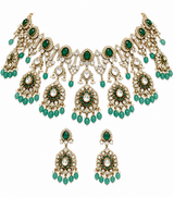 Luxurious Moissanite bridal choker necklace set featuring sparkling stones, emerald green accents, intricate floral motifs, and matching statement earrings for a regal wedding look.
