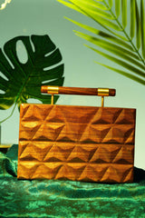 HAND CARVED TRIANGULAR PATTERN BAG WITH DOWEL HANDLE