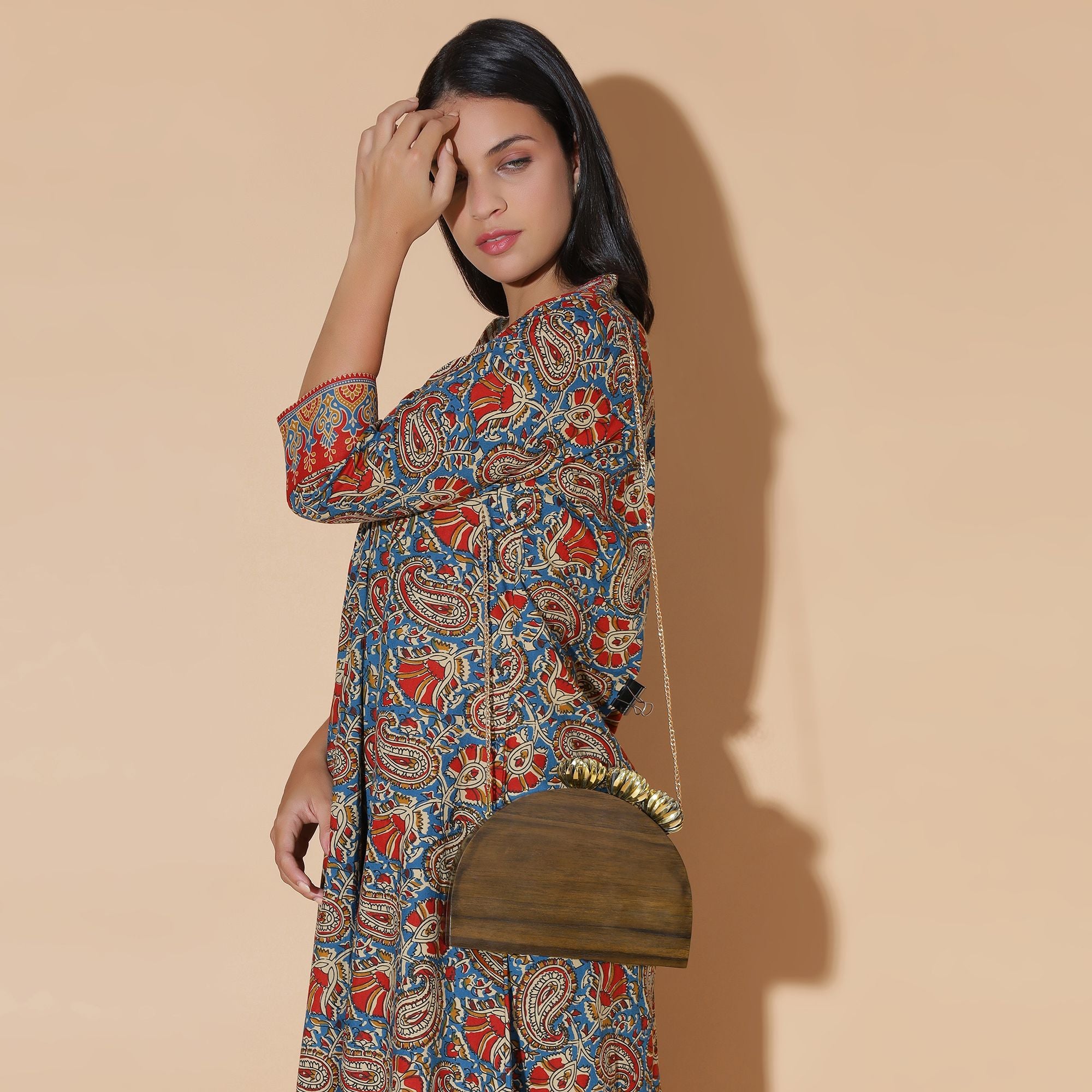 SEMI CIRCLE BAG WITH ORNATE BRASS FLOWERS IN SOLID SHEESHAM WOOD