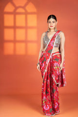 Red floral printed drape saree paired with a heavy mirror-work blouse.