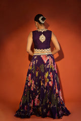 Purple floral lehenga with mirror-work waistcoat and placement dupatta.
