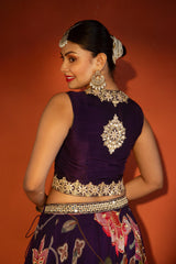 Purple floral lehenga with mirror-work waistcoat and placement dupatta.