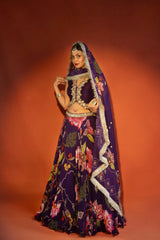 Purple floral lehenga with mirror-work waistcoat and placement dupatta.