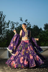 Purple floral lehenga with mirror-work waistcoat and placement dupatta.