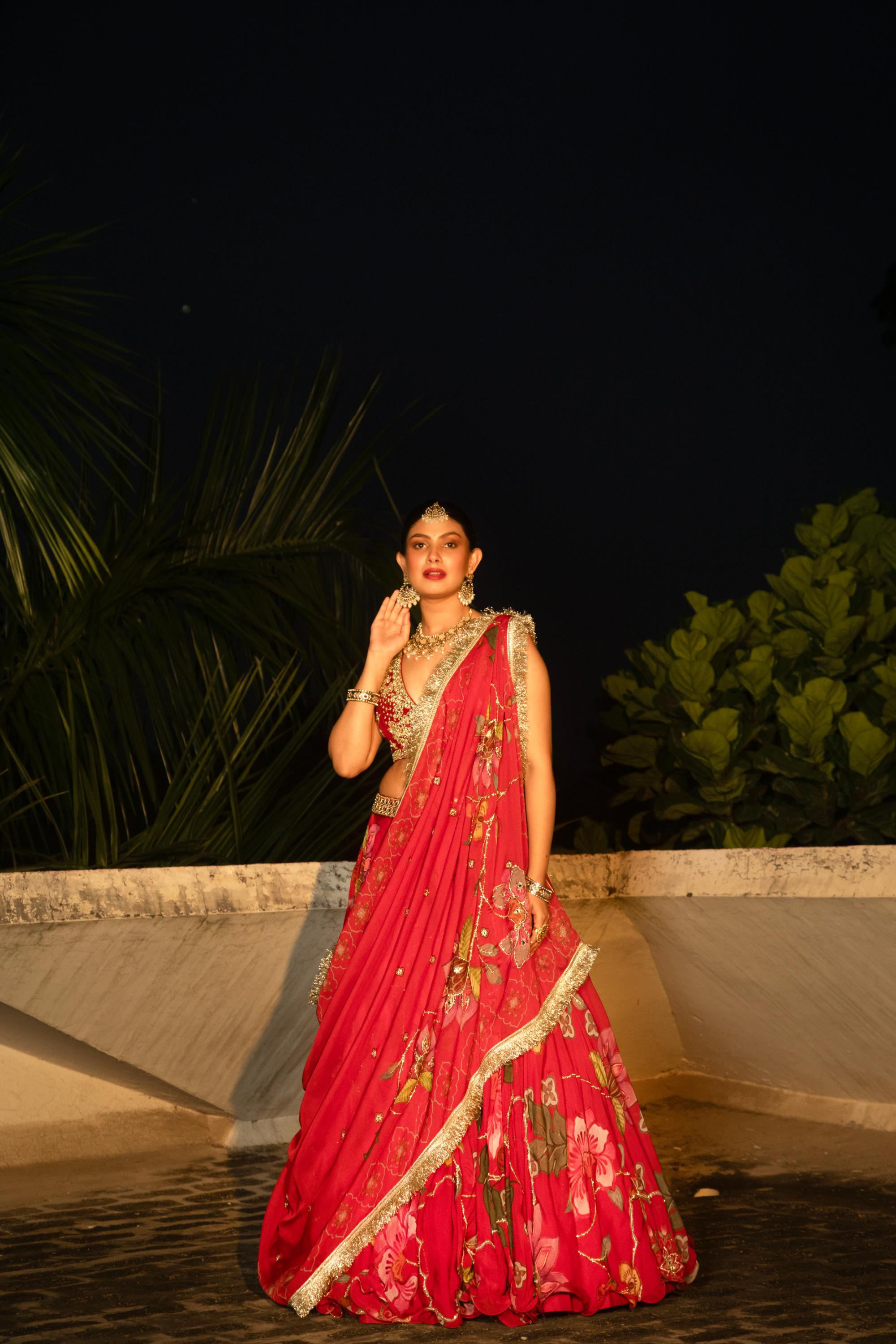 Red floral lehenga with mirror-work blouse and placement dupatta.
