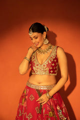 Red floral lehenga with mirror-work blouse and placement dupatta.