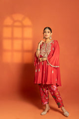 Red Short Semi- Anarkali with a heavily Embroidered Neckline, Paired with Floral Printed Salwar Pants & Dupatta