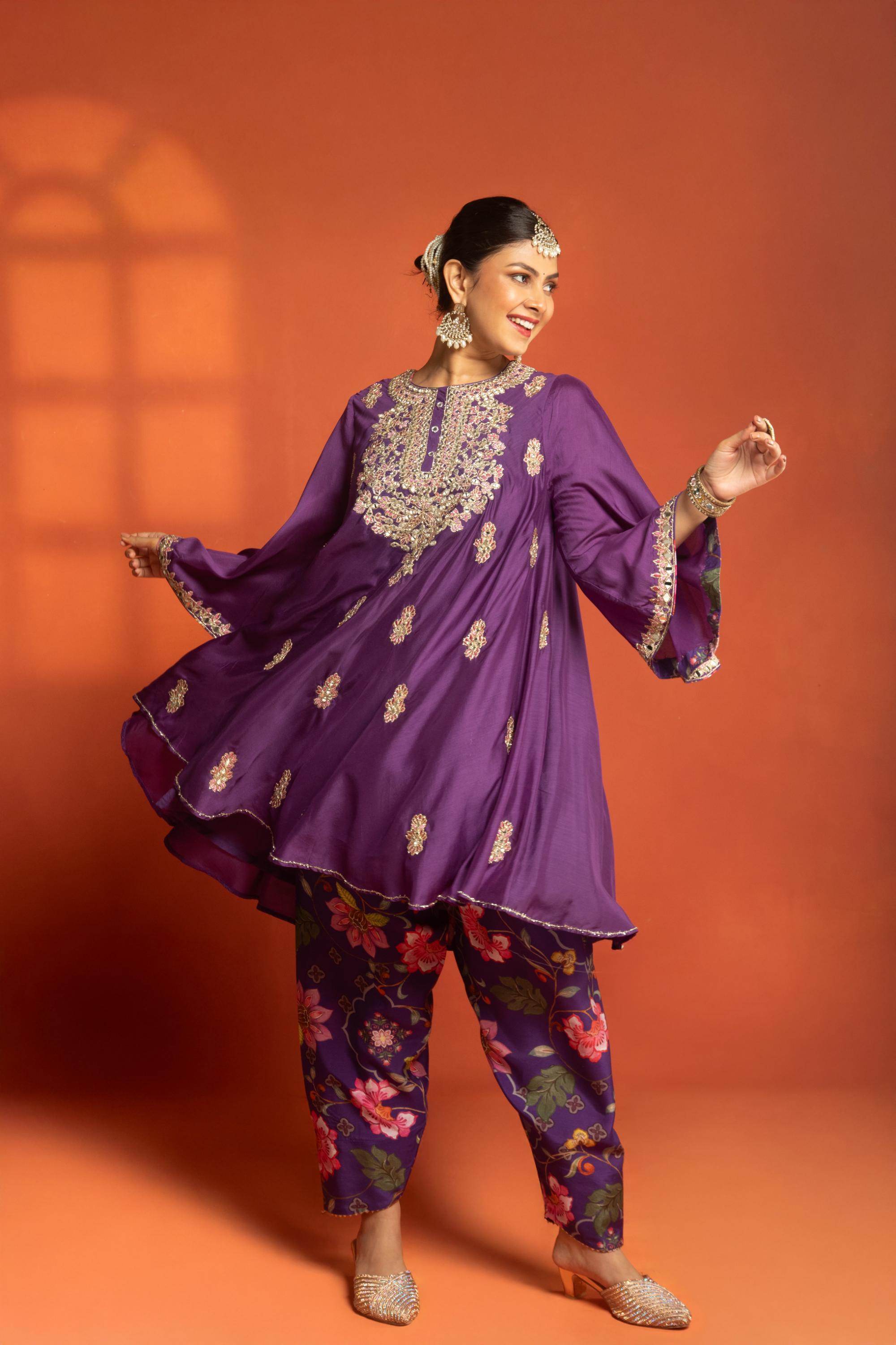 Purple Short Semi- Anarkali with a heavily Embroidered Neckline, Paired with Floral Printed Salwar Pants & Dupatta