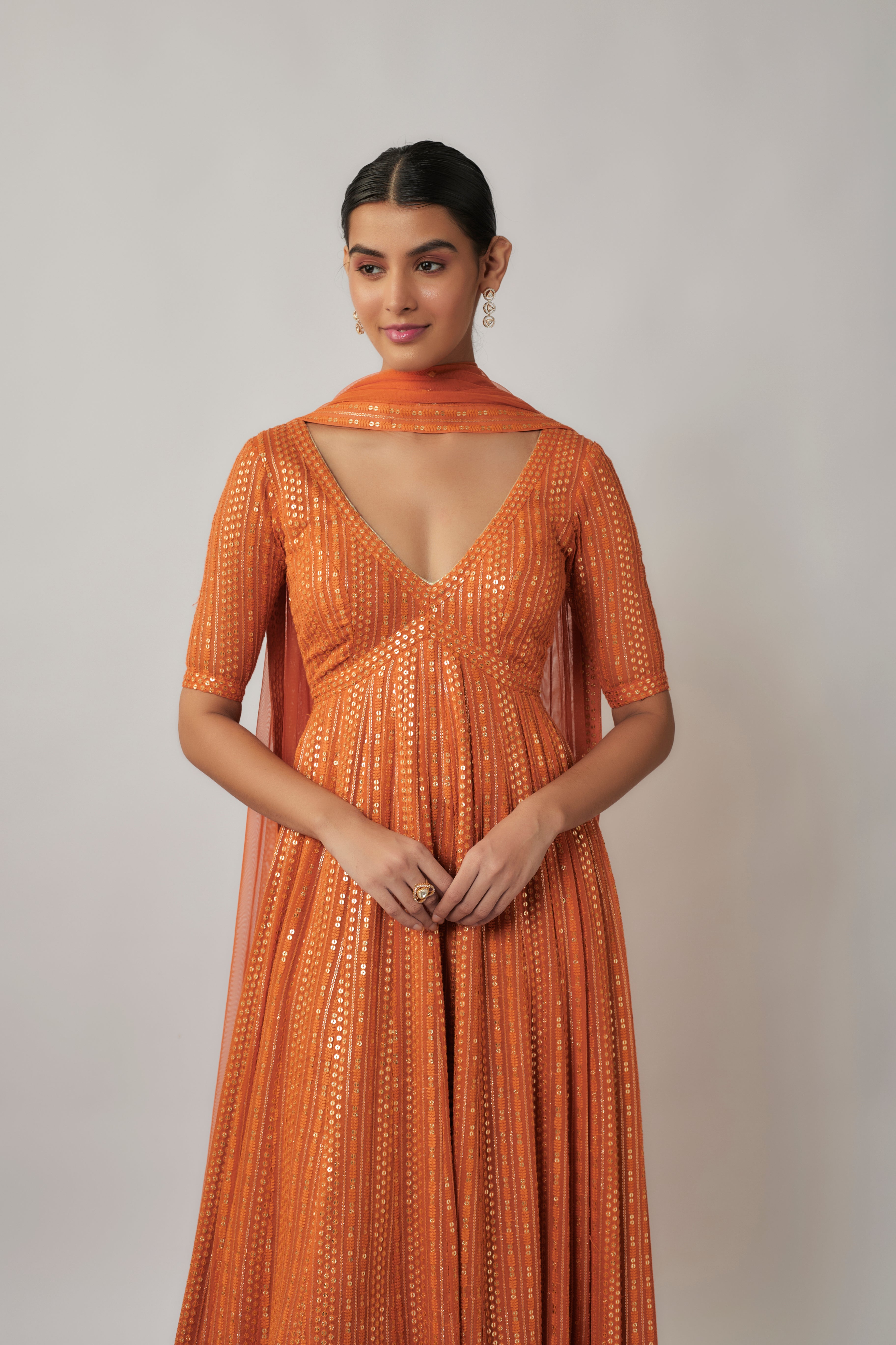 Saffron orange sequin and thread embroidered georgette anarkali gown set