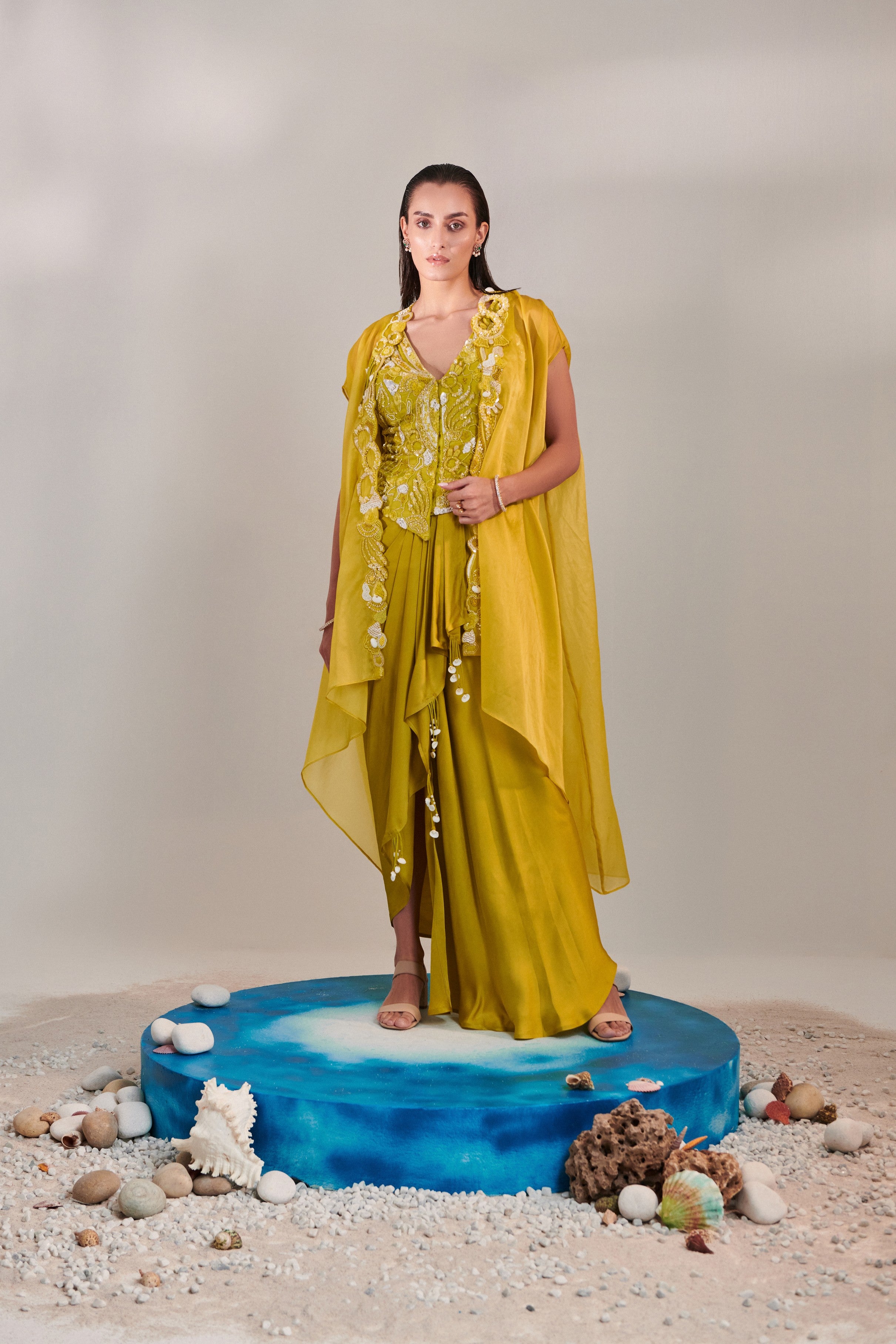Satin organza cape and fitted sleeveless jacket and drape skirt set