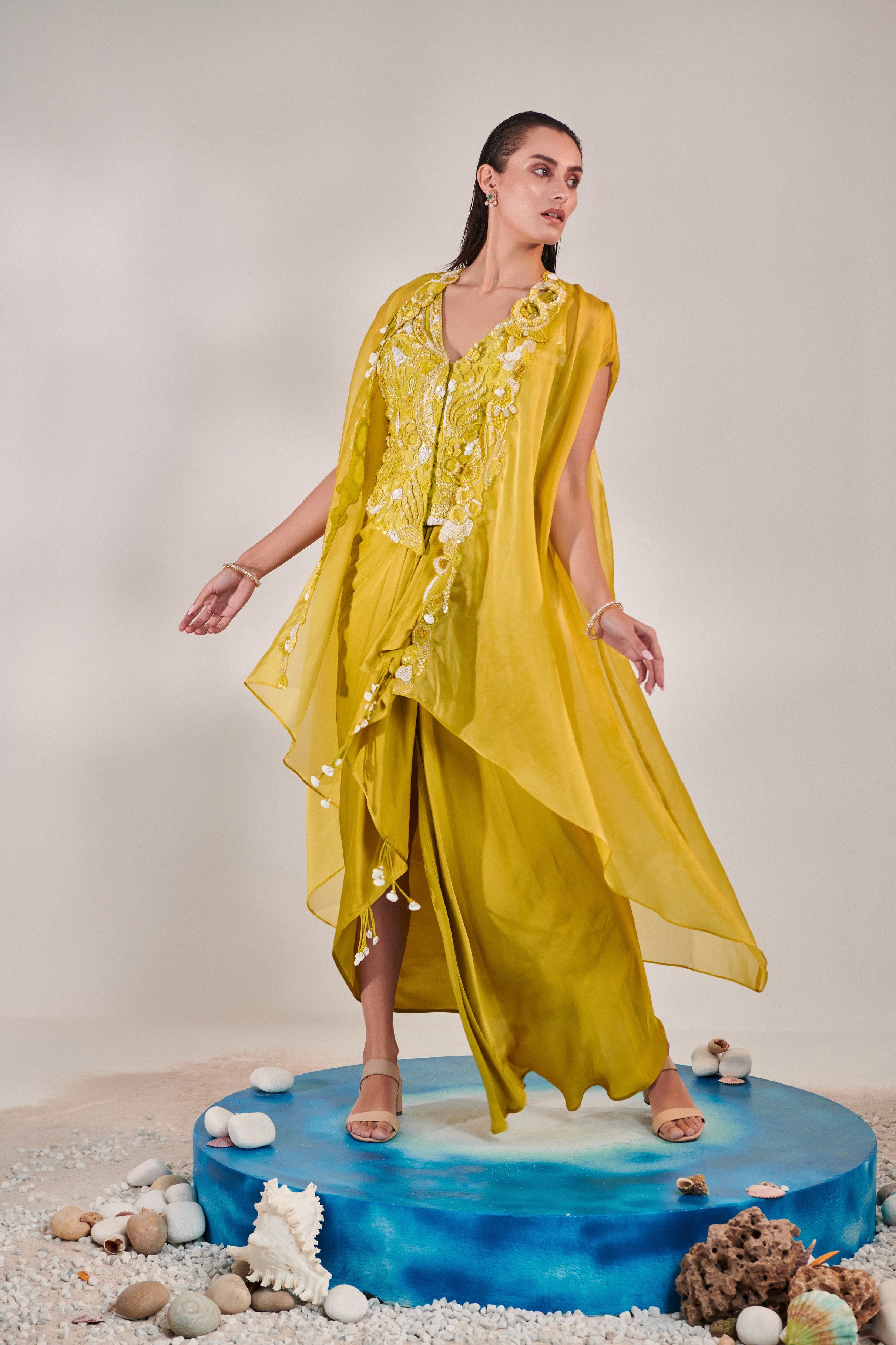 Satin organza cape and fitted sleeveless jacket and drape skirt set