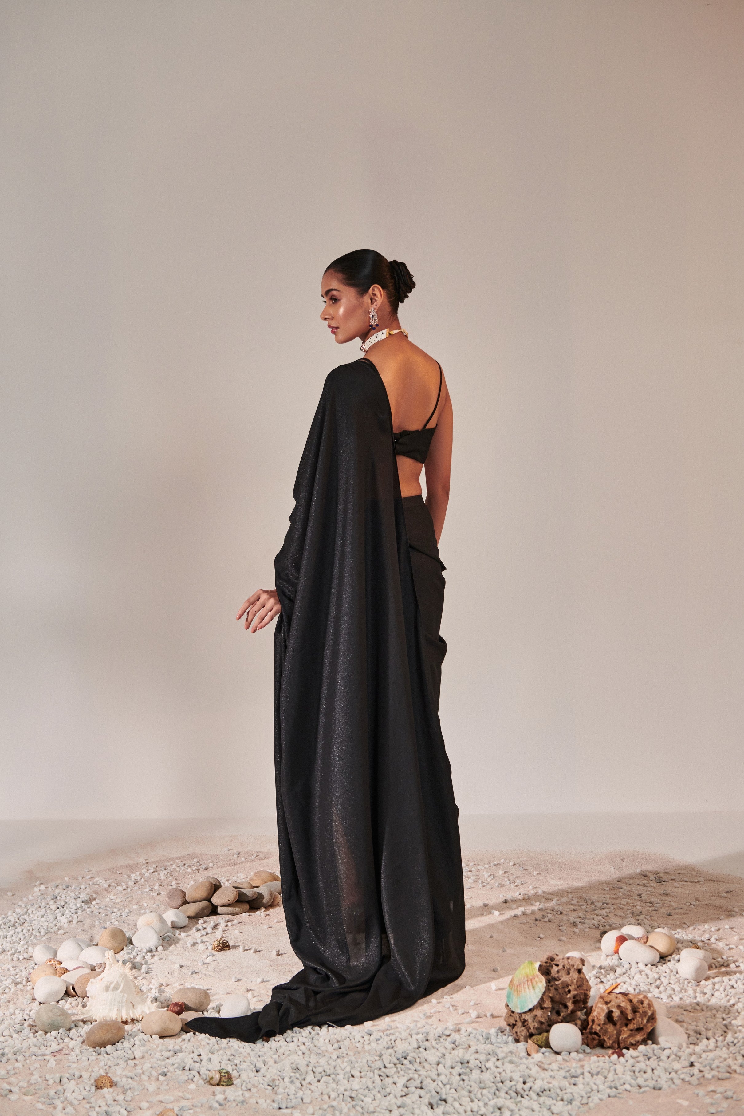 fuss-free pre-stitched drape saree; hand embroidered blouse and feather detailing