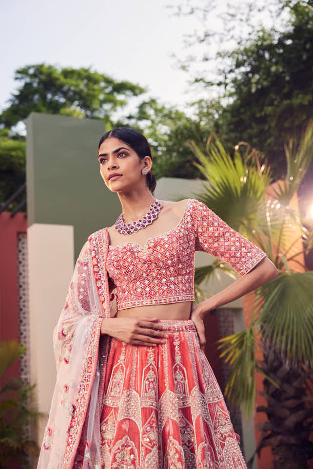 Coral velvet heavily embellished lehenga
