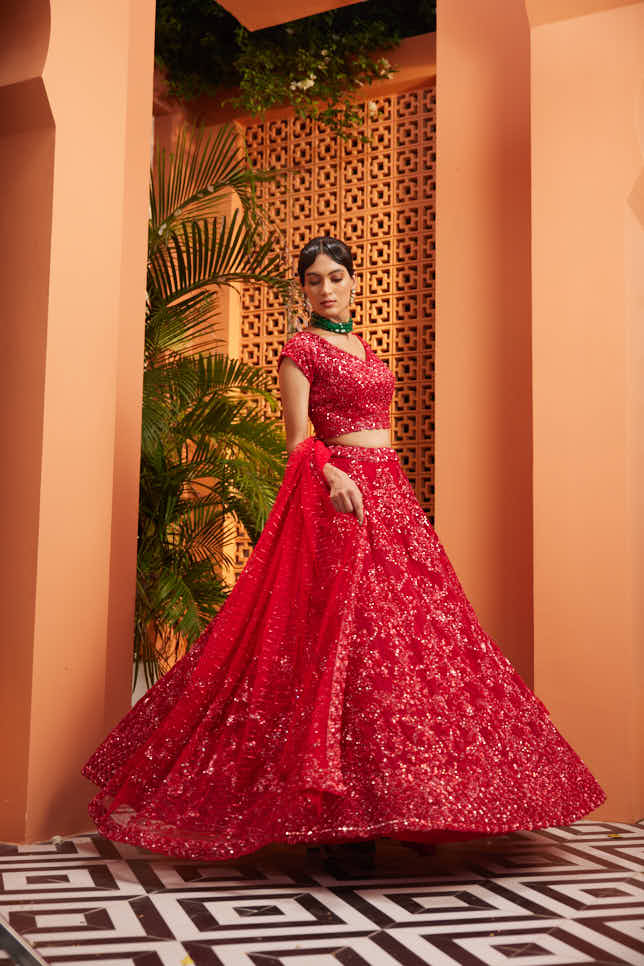 Red heavily embellished lehenga